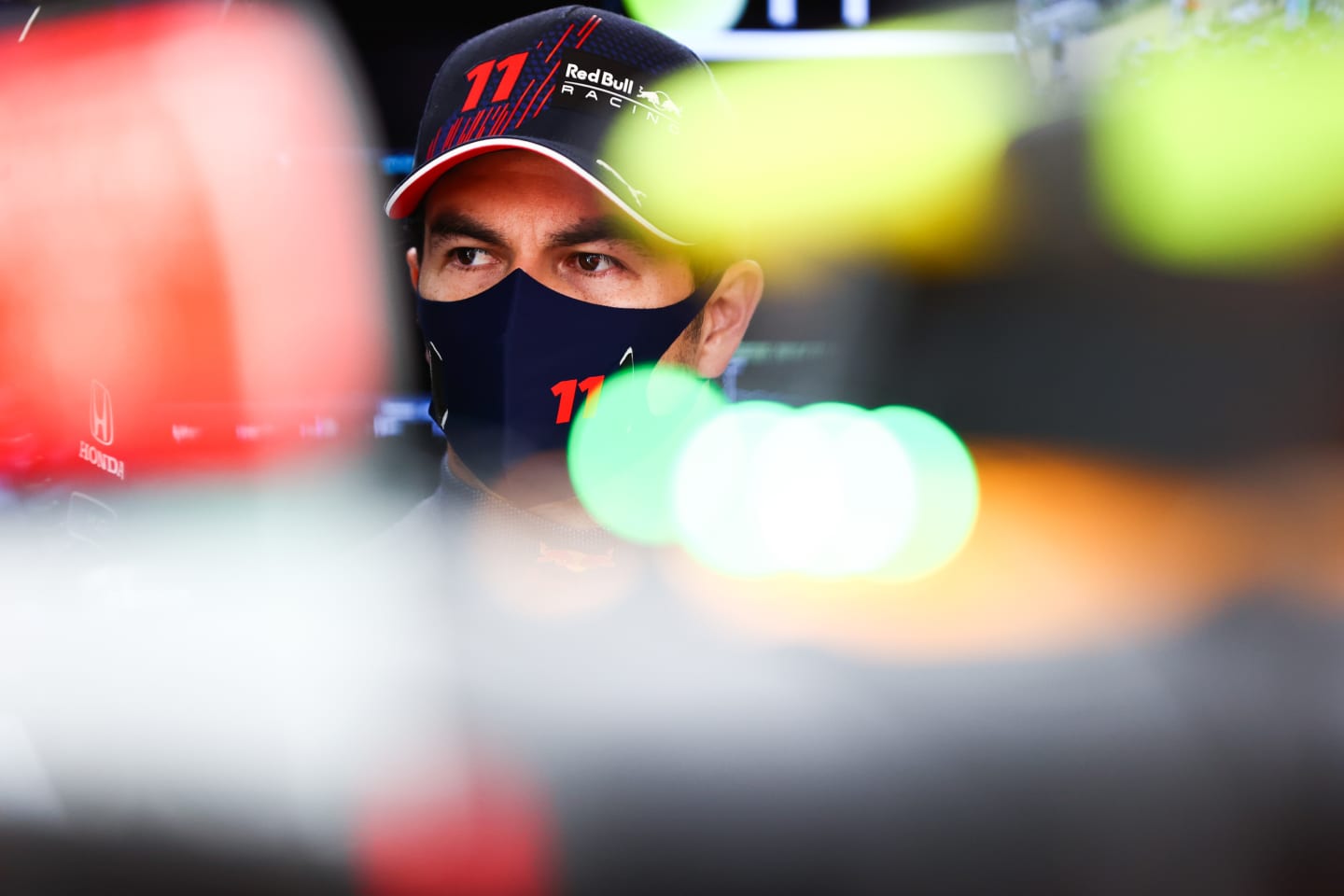 AUSTIN, TEXAS - OCTOBER 22: Sergio Perez of Mexico and Red Bull Racing prepares to drive in the garage during practice ahead of the F1 Grand Prix of USA at Circuit of The Americas on October 22, 2021 in Austin, Texas. (Photo by Mark Thompson/Getty Images)