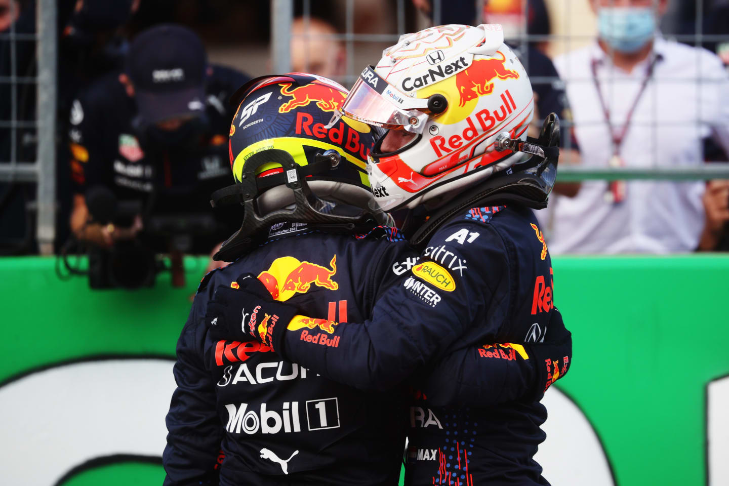 AUSTIN, TEXAS - OCTOBER 23: First place qualifier Max Verstappen of Netherlands and Red Bull Racing and third place qualifier Sergio Perez of Mexico and Red Bull Racing celebrate in parc ferme during qualifying ahead of the F1 Grand Prix of USA at Circuit of The Americas on October 23, 2021 in Austin, Texas. (Photo by Chris Graythen/Getty Images)