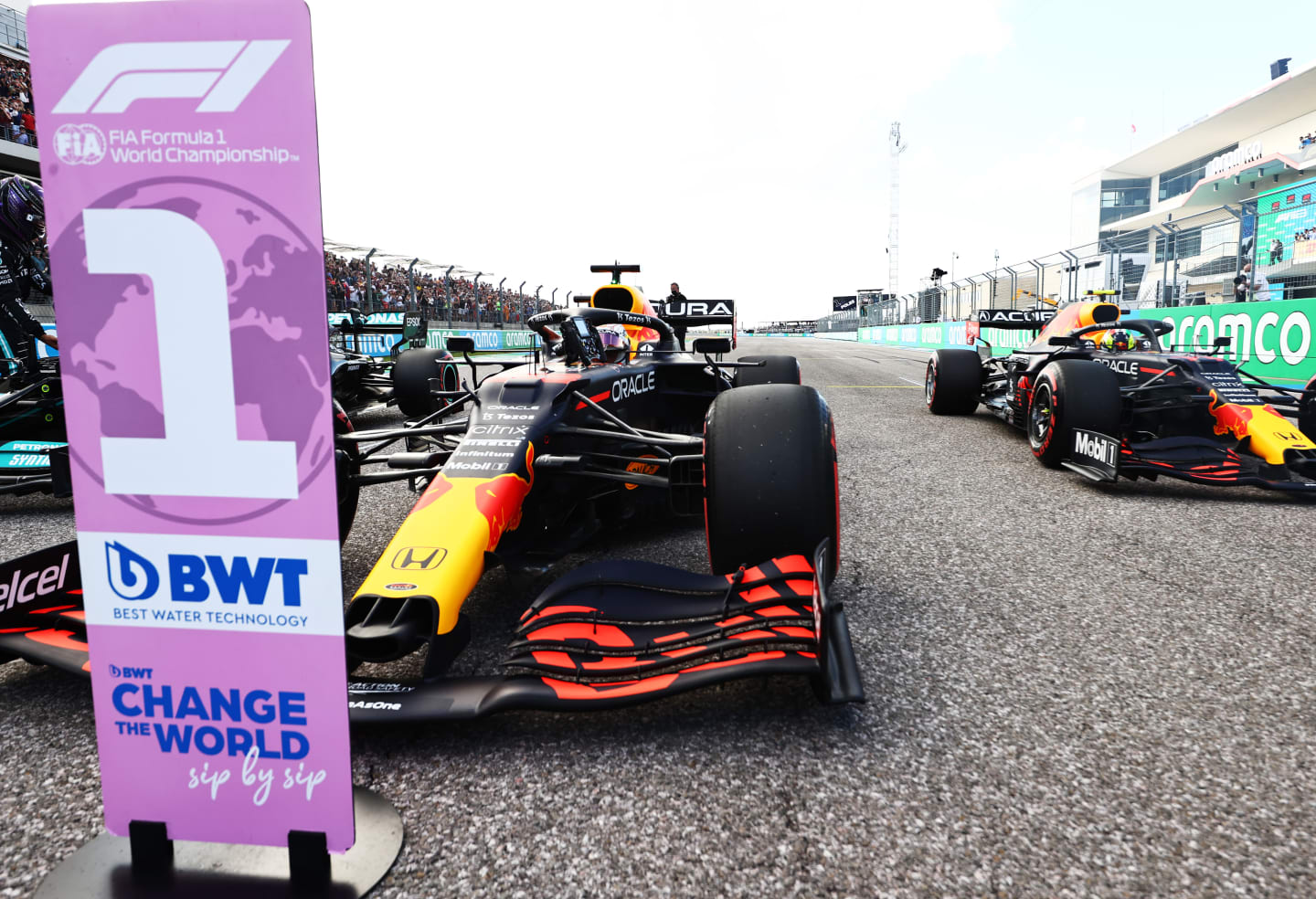 AUSTIN, TEXAS - OCTOBER 23: First place qualifier Max Verstappen of Netherlands and Red Bull Racing and third place qualifier Sergio Perez of Mexico and Red Bull Racing stop in parc ferme during qualifying ahead of the F1 Grand Prix of USA at Circuit of The Americas on October 23, 2021 in Austin, Texas. (Photo by Mark Thompson/Getty Images)