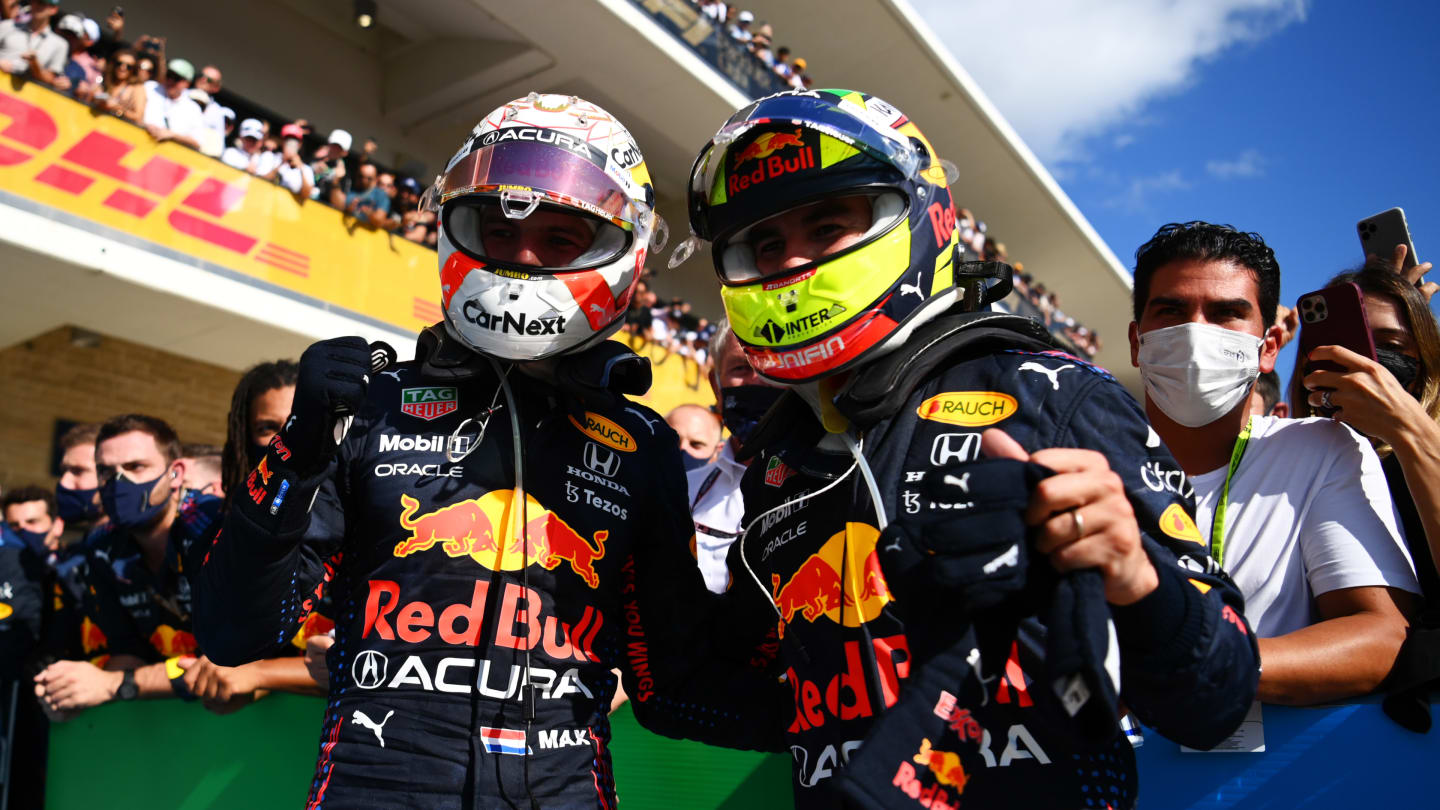 AUSTIN, TEXAS - OCTOBER 24: Race winner Max Verstappen of Netherlands and Red Bull Racing and third placed Sergio Perez of Mexico and Red Bull Racing celebrate in parc ferme during the F1 Grand Prix of USA at Circuit of The Americas on October 24, 2021 in Austin, Texas. (Photo by Clive Mason - Formula 1/Formula 1 via Getty Images)