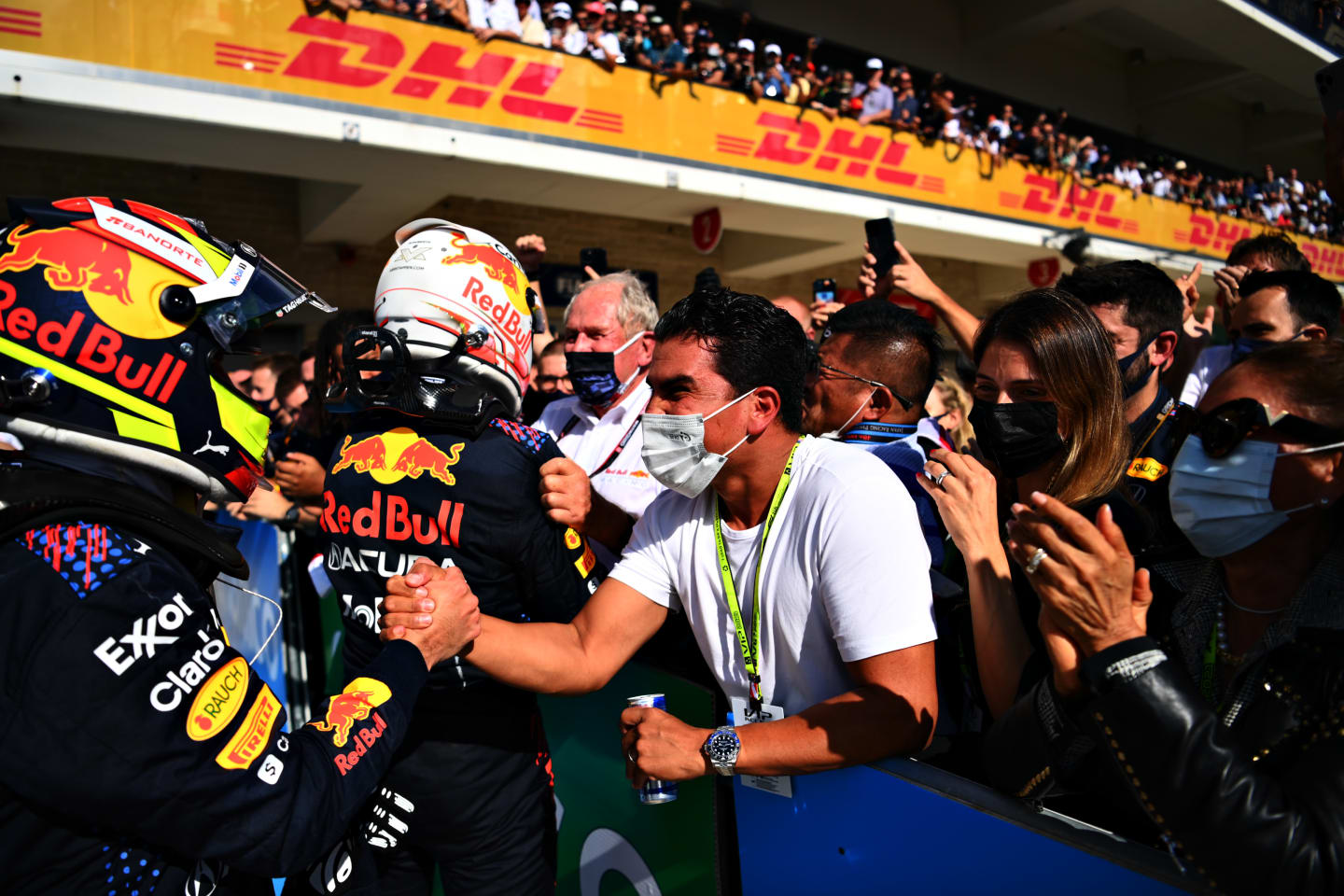 AUSTIN, TEXAS - OCTOBER 24: Race winner Max Verstappen of Netherlands and Red Bull Racing and third placed Sergio Perez of Mexico and Red Bull Racing celebrate in parc ferme during the F1 Grand Prix of USA at Circuit of The Americas on October 24, 2021 in Austin, Texas. (Photo by Clive Mason - Formula 1/Formula 1 via Getty Images)