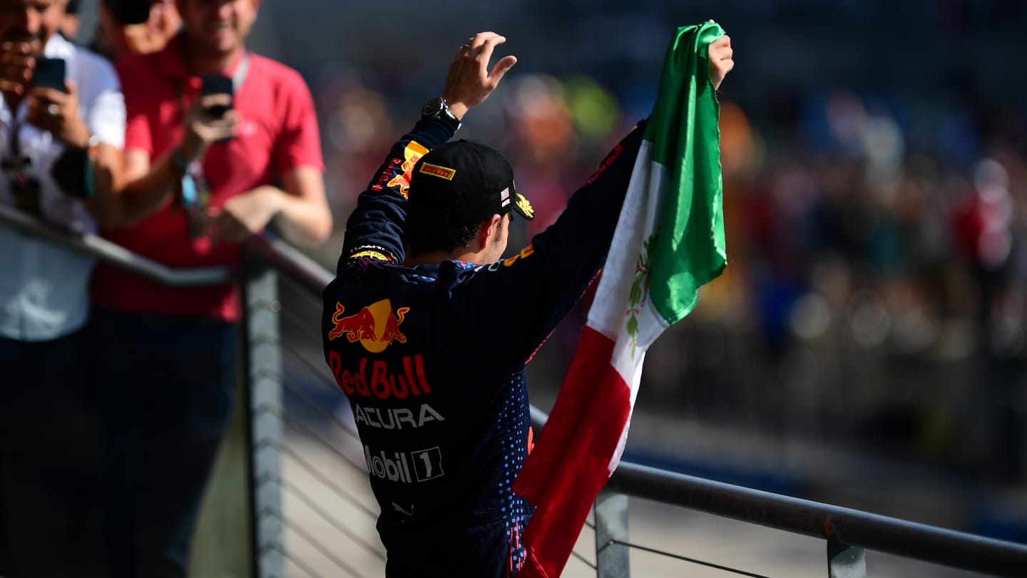 AUSTIN, TEXAS - OCTOBER 24: Third placed Sergio Perez of Mexico and Red Bull Racing celebrates on the podium during the F1 Grand Prix of USA at Circuit of The Americas on October 24, 2021 in Austin, Texas. (Photo by Mario Renzi - Formula 1/Formula 1 via Getty Images)