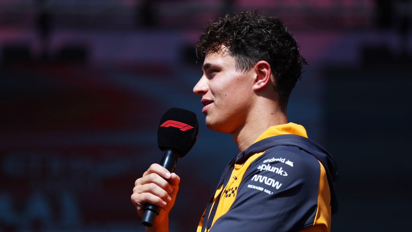 ABU DHABI, UNITED ARAB EMIRATES - NOVEMBER 18: Lando Norris of Great Britain and McLaren talks to