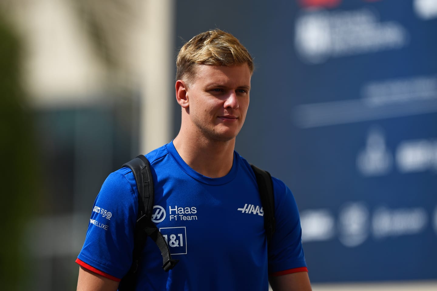 ABU DHABI, UNITED ARAB EMIRATES - NOVEMBER 19: Mick Schumacher of Germany and Haas F1 walks in the paddock during final practice ahead of the F1 Grand Prix of Abu Dhabi at Yas Marina Circuit on November 19, 2022 in Abu Dhabi, United Arab Emirates. (Photo by Rudy Carezzevoli/Getty Images)