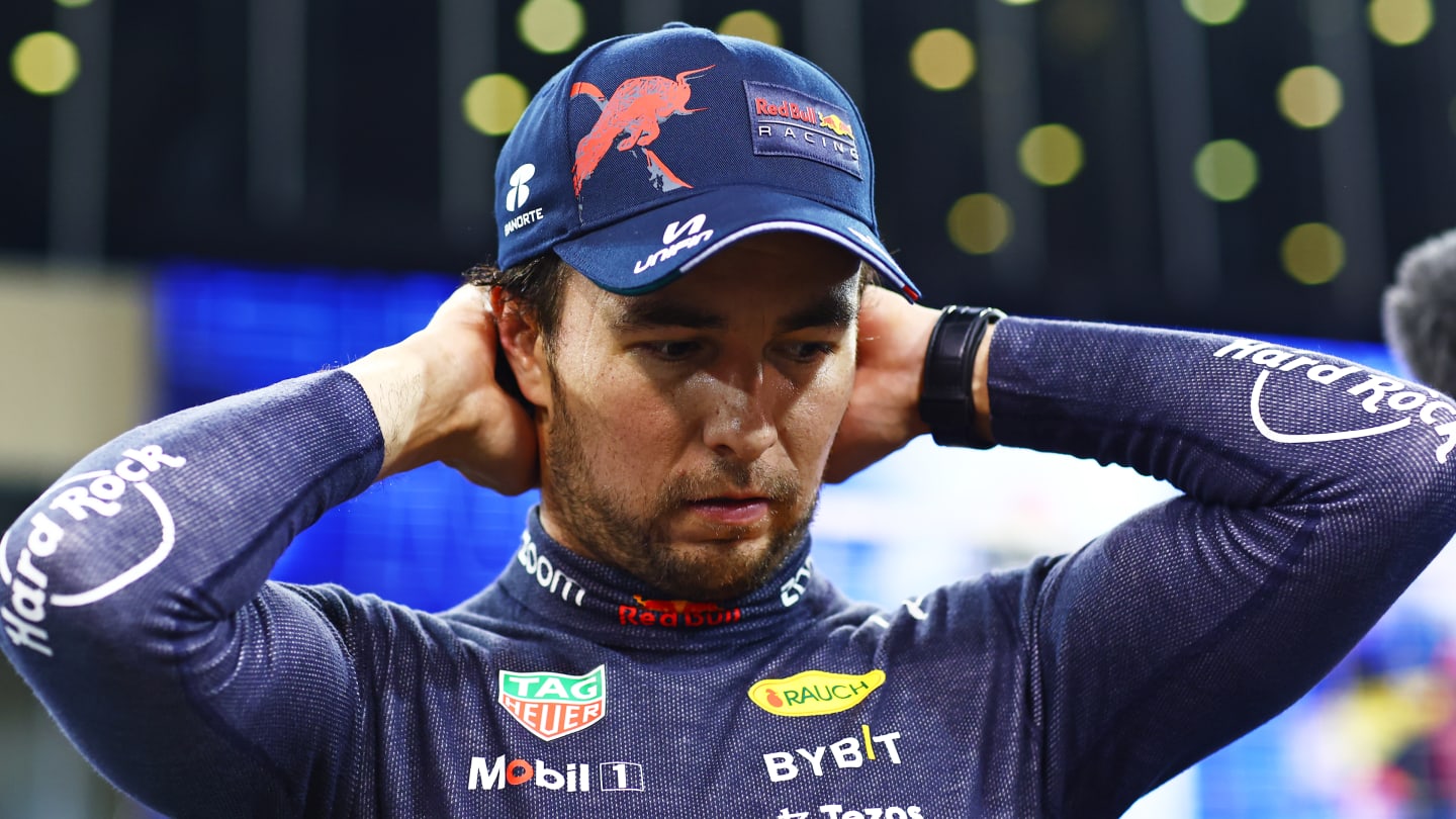 ABU DHABI, UNITED ARAB EMIRATES - NOVEMBER 19: Second placed qualifier Sergio Perez of Mexico and Oracle Red Bull Racing reacts in parc ferme during qualifying ahead of the F1 Grand Prix of Abu Dhabi at Yas Marina Circuit on November 19, 2022 in Abu Dhabi, United Arab Emirates. (Photo by Dan Istitene - Formula 1/Formula 1 via Getty Images)