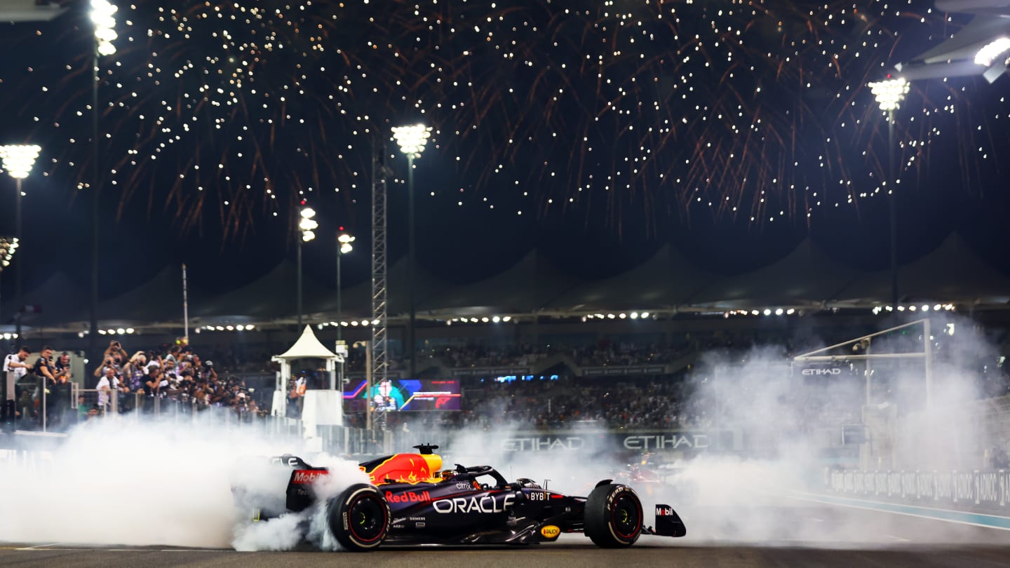 ABU DHABI, UNITED ARAB EMIRATES - NOVEMBER 20: Race winner Max Verstappen of the Netherlands driving the (1) Oracle Red Bull Racing RB18 performs a celebratory donut during the F1 Grand Prix of Abu Dhabi at Yas Marina Circuit on November 20, 2022 in Abu Dhabi, United Arab Emirates. (Photo by Dan Istitene - Formula 1/Formula 1 via Getty Images)