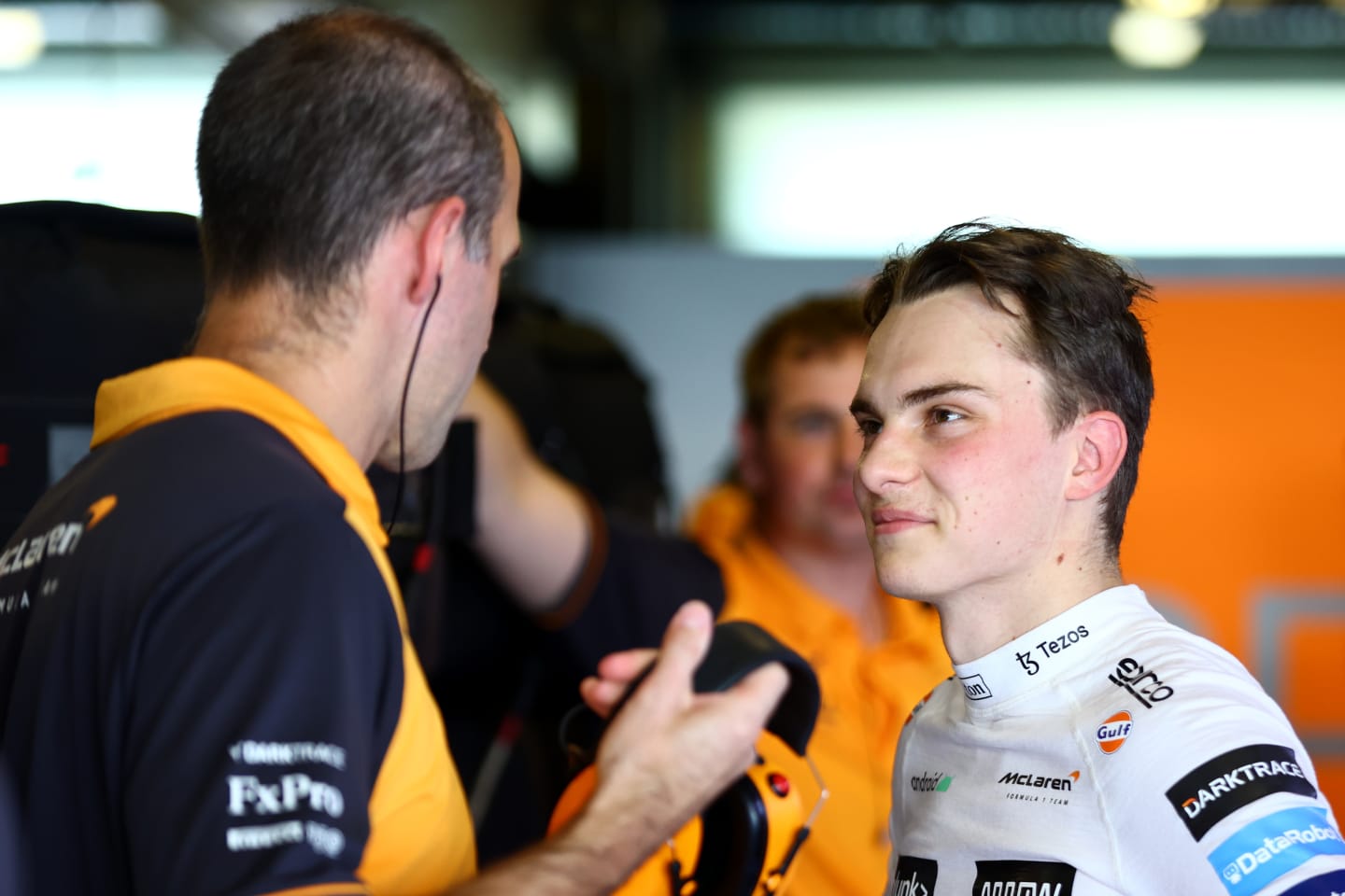 ABU DHABI, UNITED ARAB EMIRATES - NOVEMBER 22: Oscar Piastri of Australia and McLaren talks to a