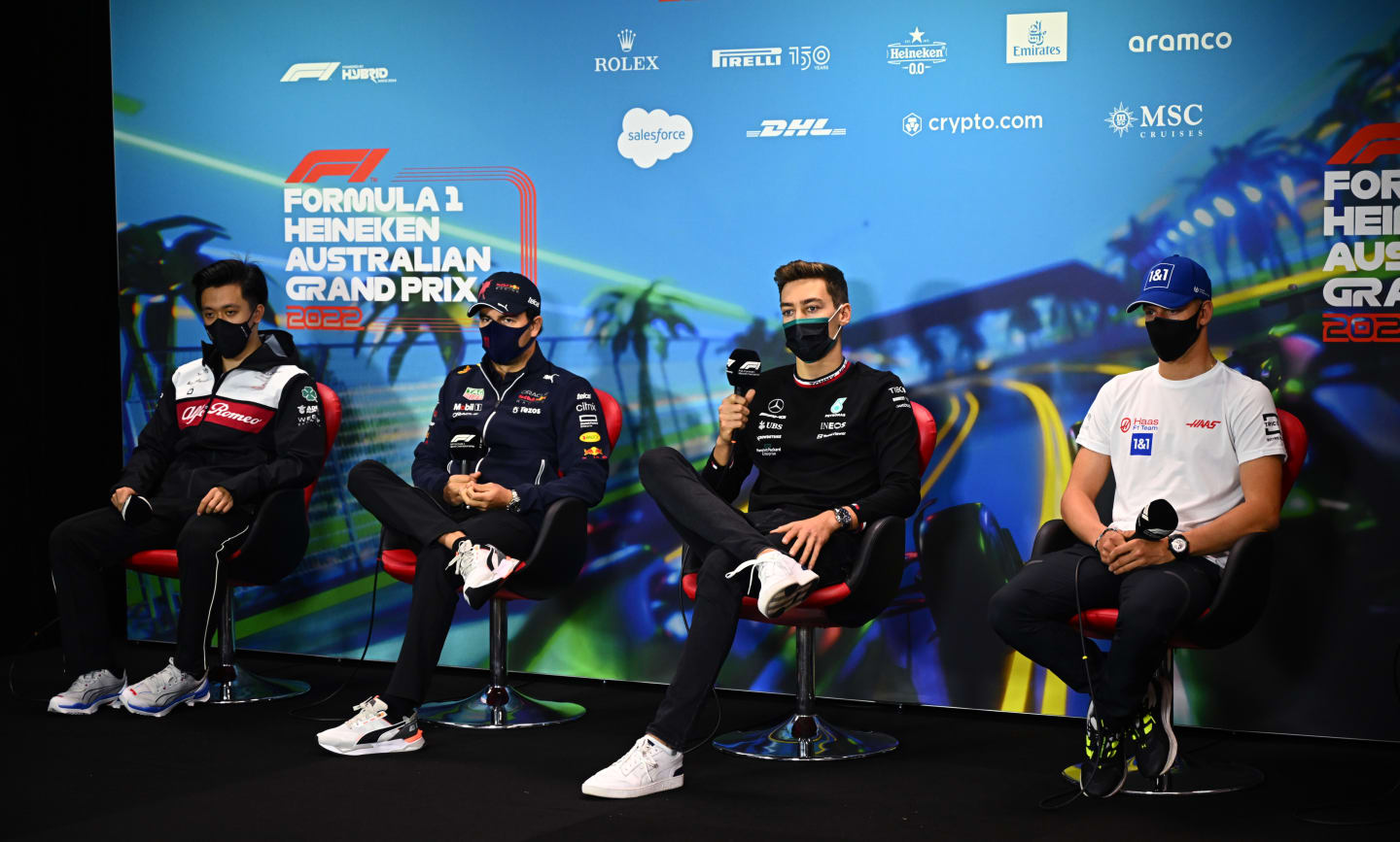 MELBOURNE, AUSTRALIA - APRIL 08: (L-R) Zhou Guanyu of China and Alfa Romeo F1, Sergio Perez of Mexico and Oracle Red Bull Racing, George Russell of Great Britain and Mercedes and Mick Schumacher of Germany and Haas F1 attend the Drivers Press Conference prior to practice ahead of the F1 Grand Prix of Australia at Melbourne Grand Prix Circuit on April 08, 2022 in Melbourne, Australia. (Photo by Clive Mason/Getty Images)