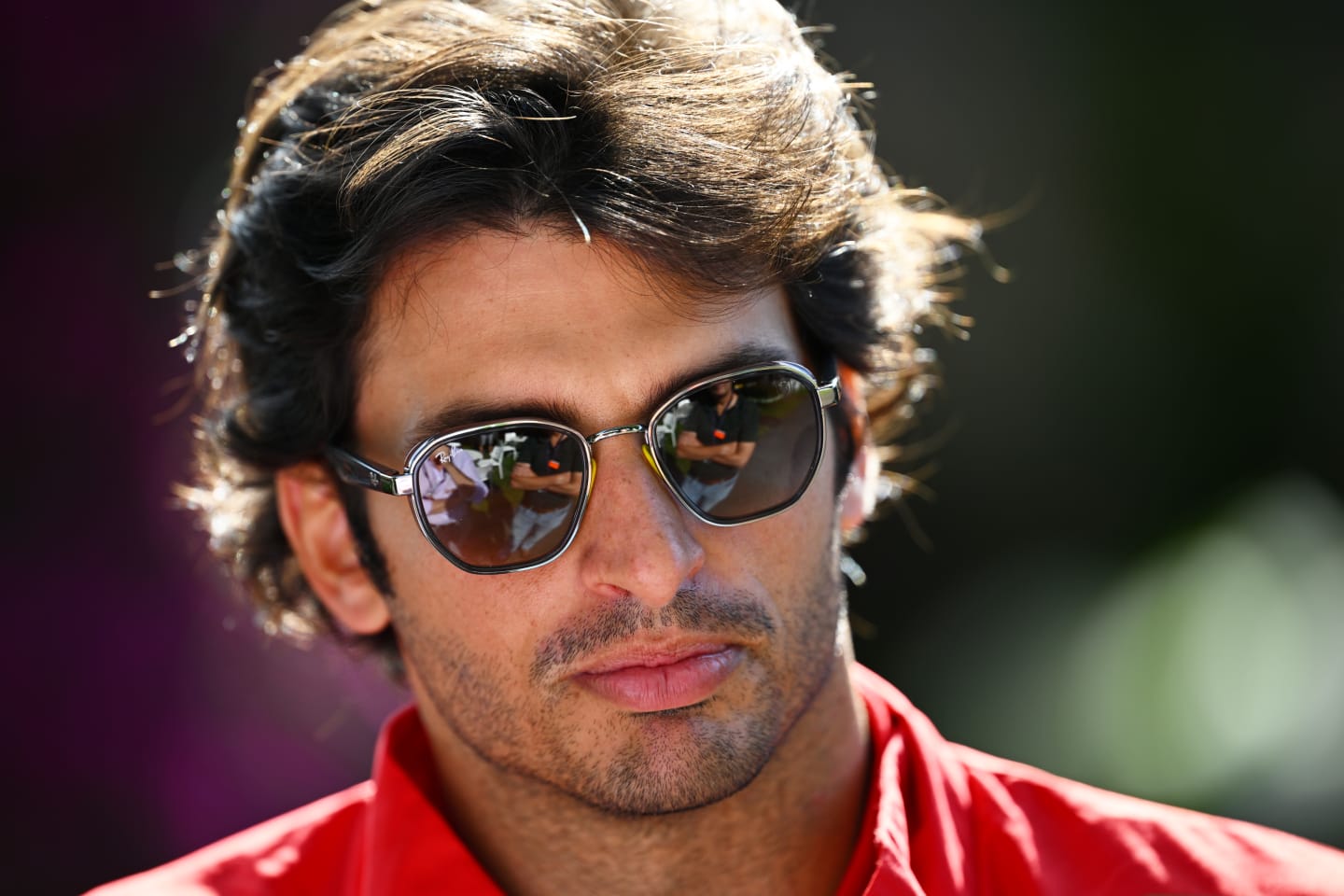 MELBOURNE, AUSTRALIA - APRIL 08: Carlos Sainz of Spain and Ferrari looks on in the Paddock prior to practice ahead of the F1 Grand Prix of Australia at Melbourne Grand Prix Circuit on April 08, 2022 in Melbourne, Australia. (Photo by Clive Mason/Getty Images)