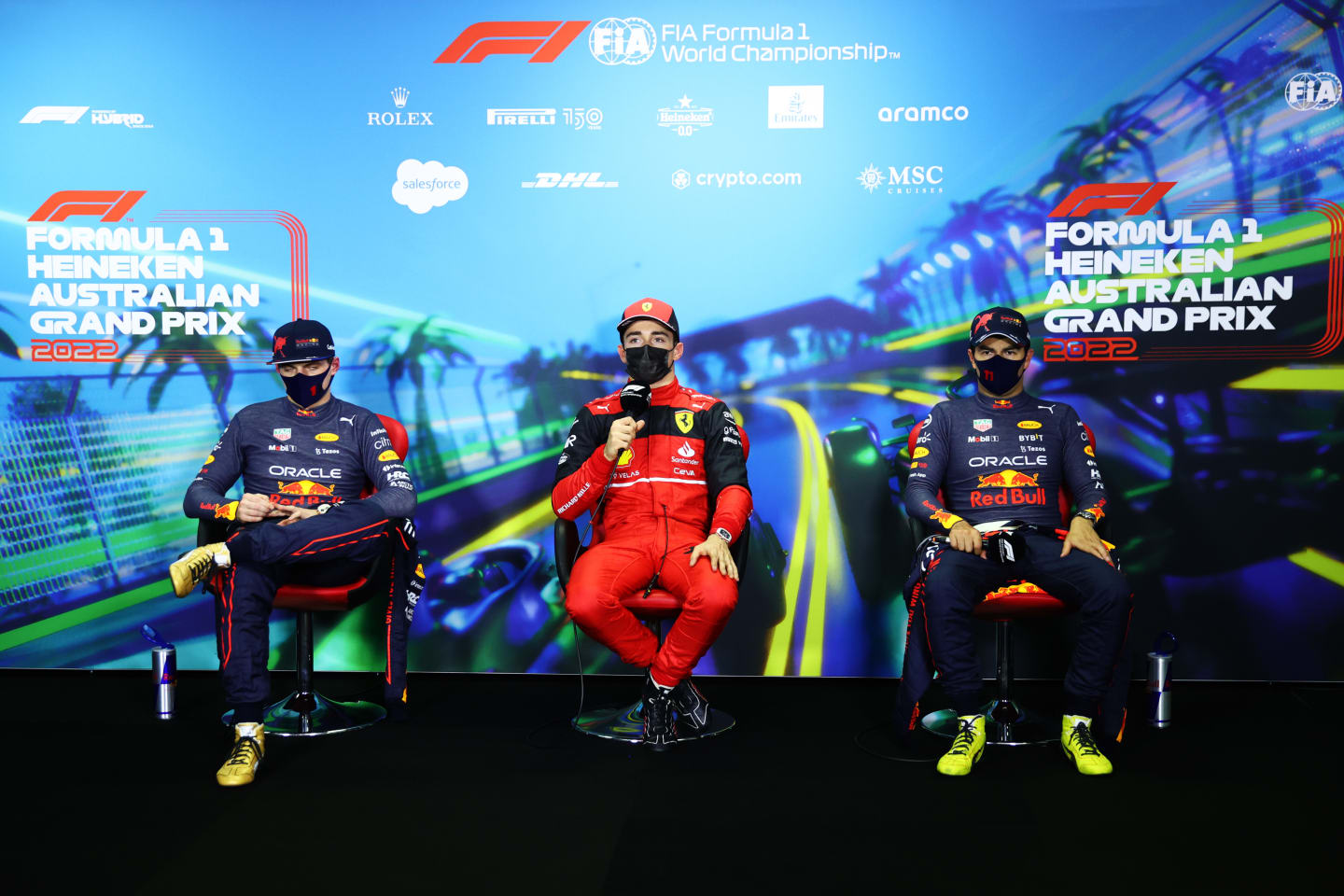MELBOURNE, AUSTRALIA - APRIL 09: Pole position qualifier Charles Leclerc of Monaco and Ferrari (C), Second placed qualifier Max Verstappen of the Netherlands and Oracle Red Bull Racing (L) and Third placed qualifier Sergio Perez of Mexico and Oracle Red Bull Racing (R) talk in the press conference after qualifying ahead of the F1 Grand Prix of Australia at Melbourne Grand Prix Circuit on April 09, 2022 in Melbourne, Australia. (Photo by Dan Istitene - Formula 1/Formula 1 via Getty Images)