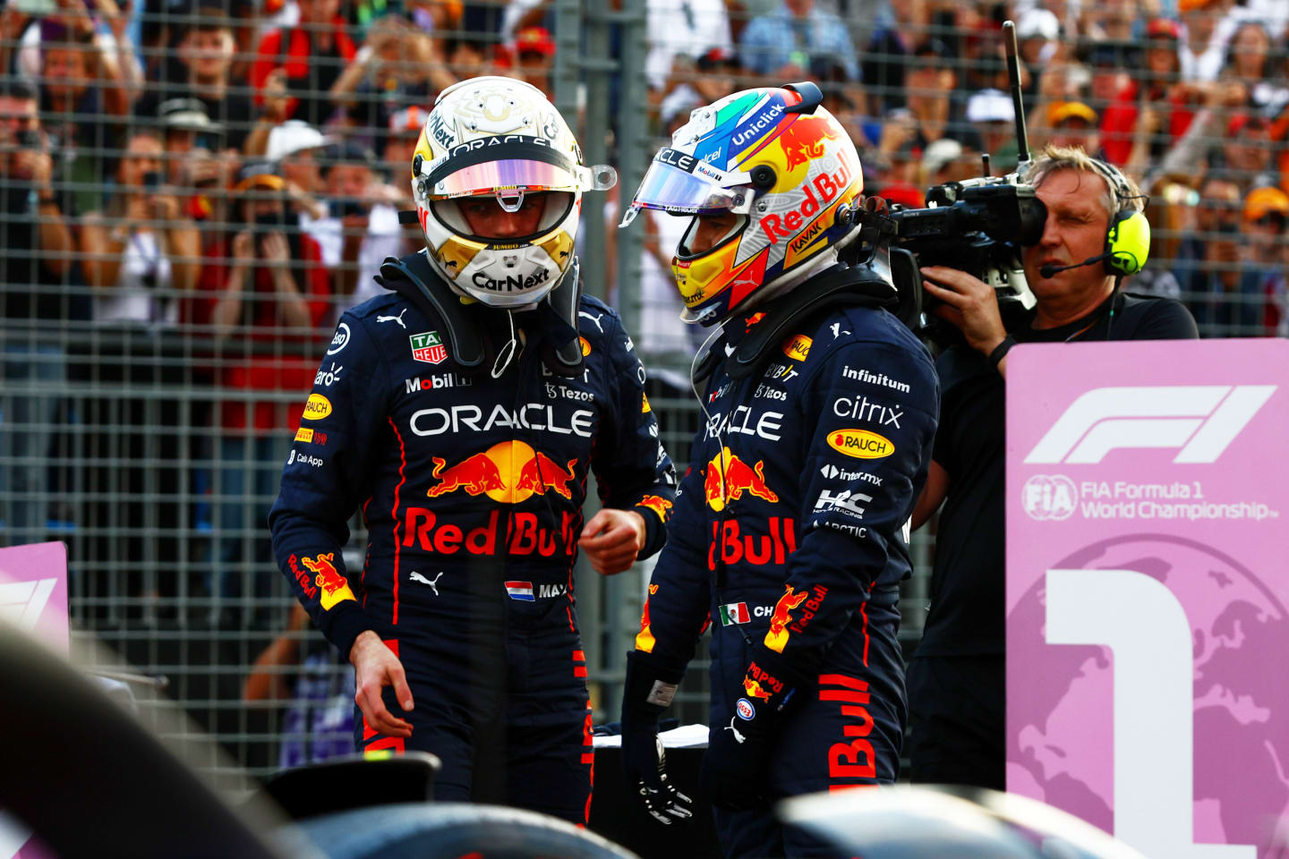 MELBOURNE, AUSTRALIA - APRIL 09: Second placed qualifier Max Verstappen of the Netherlands and Oracle Red Bull Racing and Third placed qualifier Sergio Perez of Mexico and Oracle Red Bull Racing talk in parc ferme during qualifying ahead of the F1 Grand Prix of Australia at Melbourne Grand Prix Circuit on April 09, 2022 in Melbourne, Australia. (Photo by Mark Thompson/Getty Images)