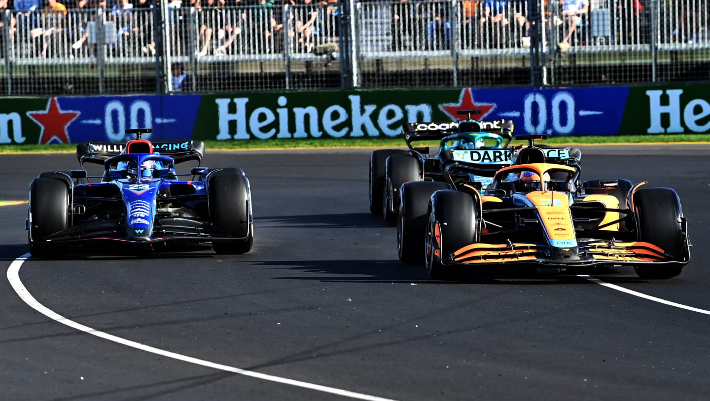 MELBOURNE, AUSTRALIA - APRIL 10: Daniel Ricciardo of Australia driving the (3) McLaren MCL36 Mercedes leads Alexander Albon of Thailand driving the (23) Williams FW44 Mercedes and Lance Stroll of Canada driving the (18) Aston Martin AMR22 Mercedes during the F1 Grand Prix of Australia at Melbourne Grand Prix Circuit on April 10, 2022 in Melbourne, Australia. (Photo by Bill Murray/Getty Images for Heineken)