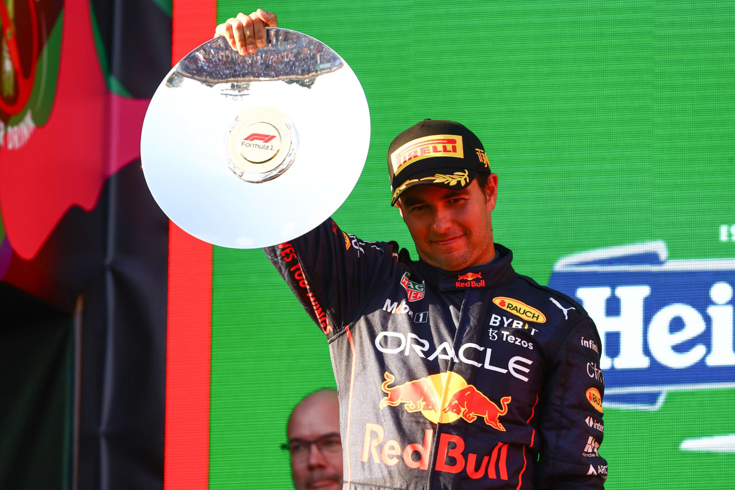 MELBOURNE, AUSTRALIA - APRIL 10: Second placed Sergio Perez of Mexico and Oracle Red Bull Racing celebrates on the podium during the F1 Grand Prix of Australia at Melbourne Grand Prix Circuit on April 10, 2022 in Melbourne, Australia. (Photo by Mark Thompson/Getty Images)