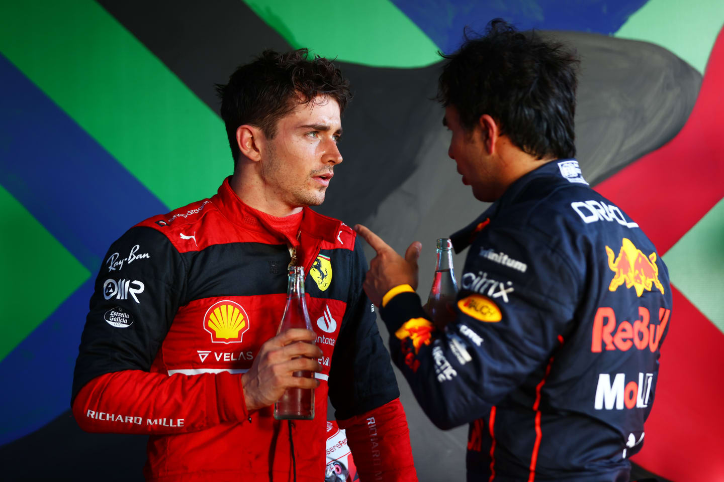 MELBOURNE, AUSTRALIA - APRIL 10: Race winner Charles Leclerc of Monaco and Ferrari and Second placed Sergio Perez of Mexico and Oracle Red Bull Racing talk in parc ferme during the F1 Grand Prix of Australia at Melbourne Grand Prix Circuit on April 10, 2022 in Melbourne, Australia. (Photo by Dan Istitene - Formula 1/Formula 1 via Getty Images)