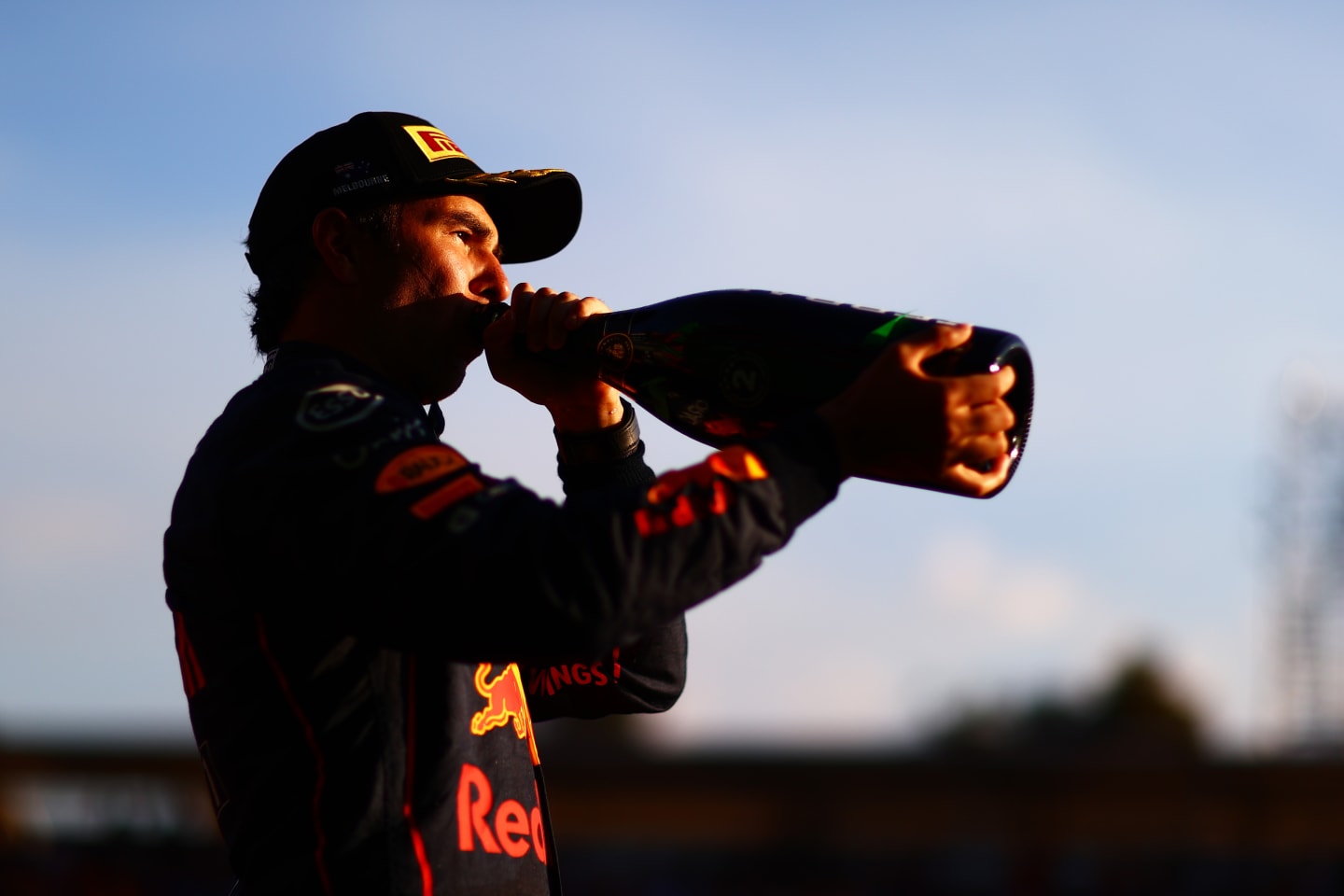 MELBOURNE, AUSTRALIA - APRIL 10: Second placed Sergio Perez of Mexico and Oracle Red Bull Racing celebrates on the podium during the F1 Grand Prix of Australia at Melbourne Grand Prix Circuit on April 10, 2022 in Melbourne, Australia. (Photo by Dan Istitene - Formula 1/Formula 1 via Getty Images)
