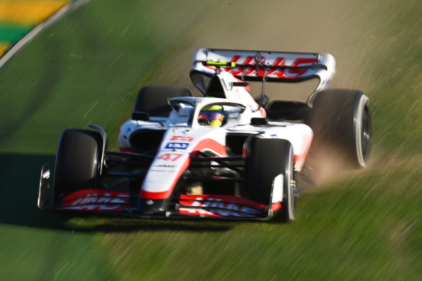 MELBOURNE, AUSTRALIA - APRIL 10: Mick Schumacher of Germany driving the (47) Haas F1 VF-22 Ferrari runs wide during the F1 Grand Prix of Australia at Melbourne Grand Prix Circuit on April 10, 2022 in Melbourne, Australia. (Photo by Clive Mason/Getty Images)