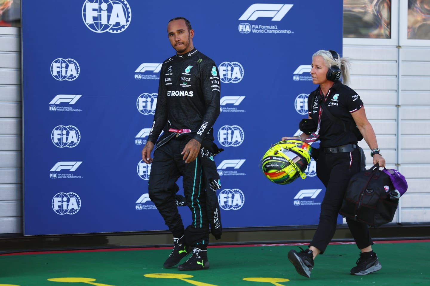 SPIELBERG, AUSTRIA - JULY 08: Lewis Hamilton of Great Britain and Mercedes walks in the Pitlane after a crash during qualifying ahead of the F1 Grand Prix of Austria at Red Bull Ring on July 08, 2022 in Spielberg, Austria. (Photo by Lars Baron - Formula 1/Formula 1 via Getty Images)