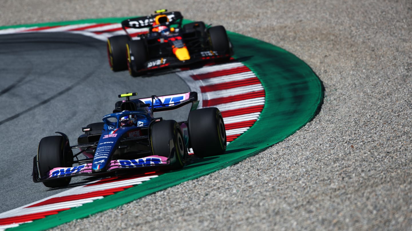 SPIELBERG, AUSTRIA - JULY 09: Esteban Ocon of France driving the (31) Alpine F1 A522 Renault leads Sergio Perez of Mexico driving the (11) Oracle Red Bull Racing RB18 during the F1 Grand Prix of Austria Sprint at Red Bull Ring on July 09, 2022 in Spielberg, Austria. (Photo by Joe Portlock - Formula 1/Formula 1 via Getty Images)