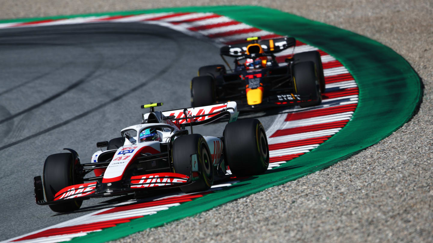 SPIELBERG, AUSTRIA - JULY 09: Mick Schumacher of Germany driving the (47) Haas F1 VF-22 Ferrari leads Sergio Perez of Mexico driving the (11) Oracle Red Bull Racing RB18 during the F1 Grand Prix of Austria Sprint at Red Bull Ring on July 09, 2022 in Spielberg, Austria. (Photo by Joe Portlock - Formula 1/Formula 1 via Getty Images)
