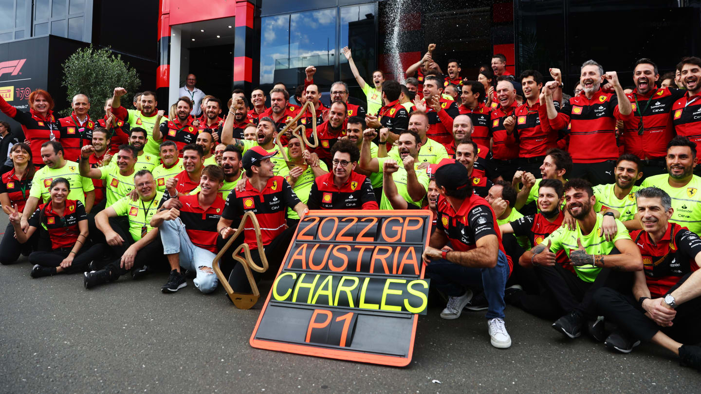 SPIELBERG, AUSTRIA - JULY 10: Race winner Charles Leclerc of Monaco and Ferrari celebrates with his team after the F1 Grand Prix of Austria at Red Bull Ring on July 10, 2022 in Spielberg, Austria. (Photo by Lars Baron - Formula 1/Formula 1 via Getty Images)