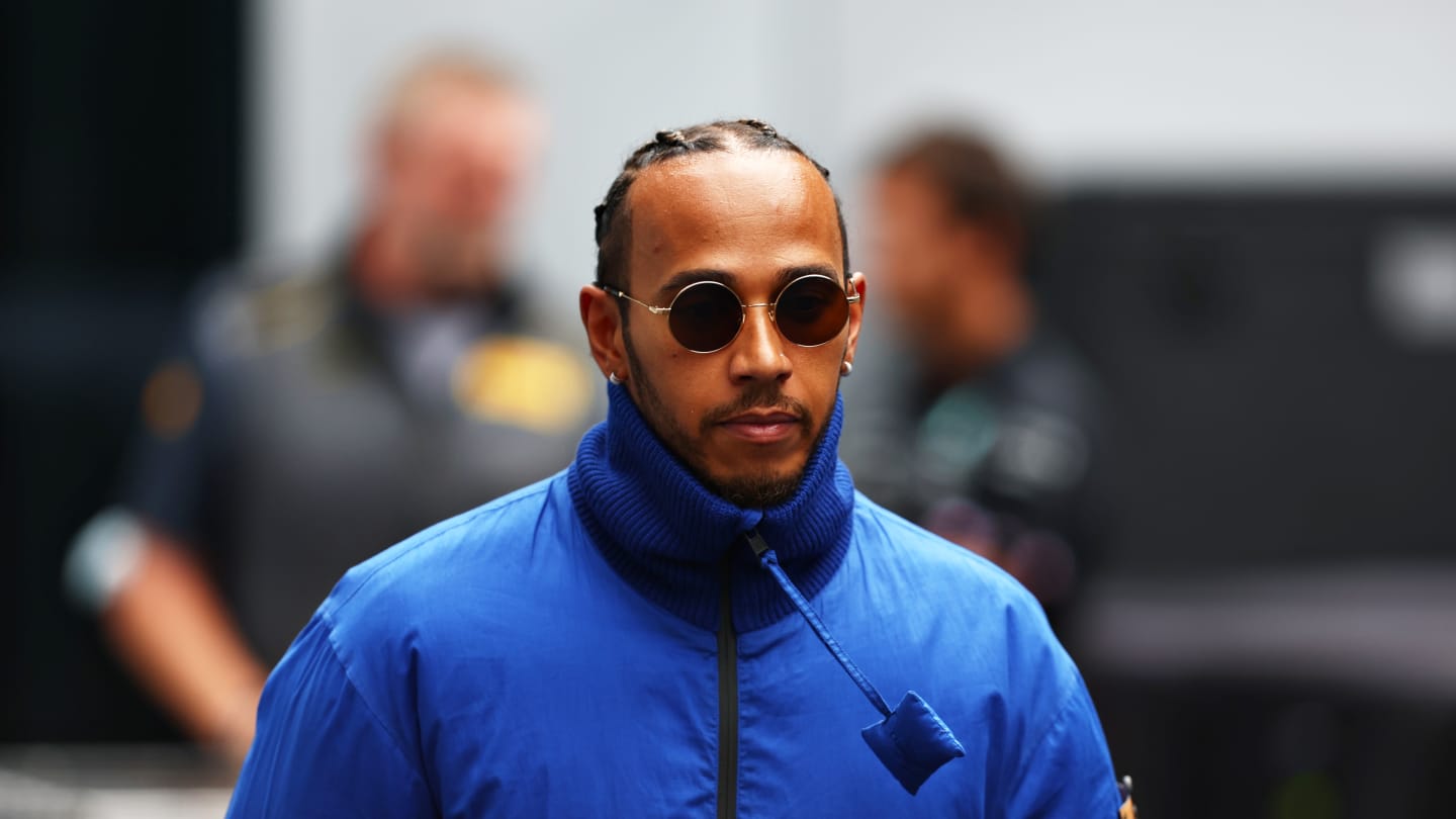 SPIELBERG, AUSTRIA - JULY 07: Lewis Hamilton of Great Britain and Mercedes walks in the Paddock