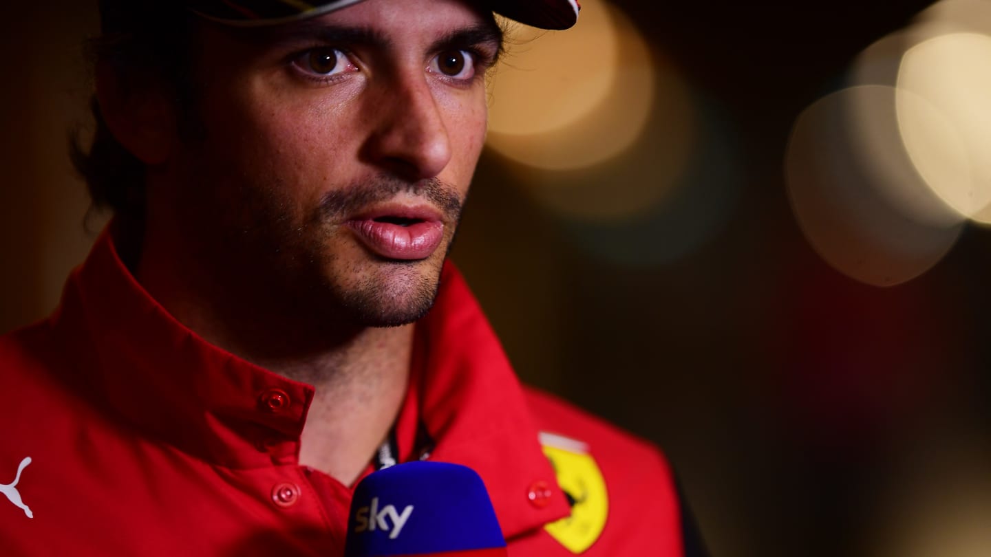 SPIELBERG, AUSTRIA - JULY 07: Carlos Sainz of Spain and Ferrari talks to the media in the Paddock