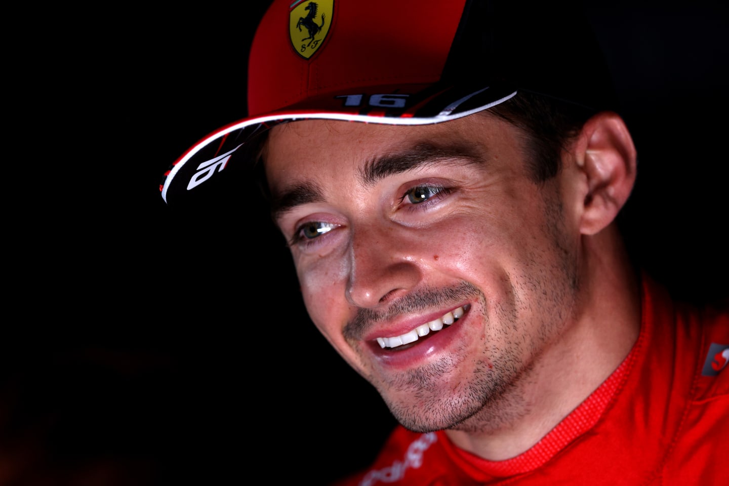 BAKU, AZERBAIJAN - JUNE 11: Pole position qualifier Charles Leclerc of Monaco and Ferrari talks to the media in the Paddock after qualifying ahead of the F1 Grand Prix of Azerbaijan at Baku City Circuit on June 11, 2022 in Baku, Azerbaijan. (Photo by Clive Rose/Getty Images)