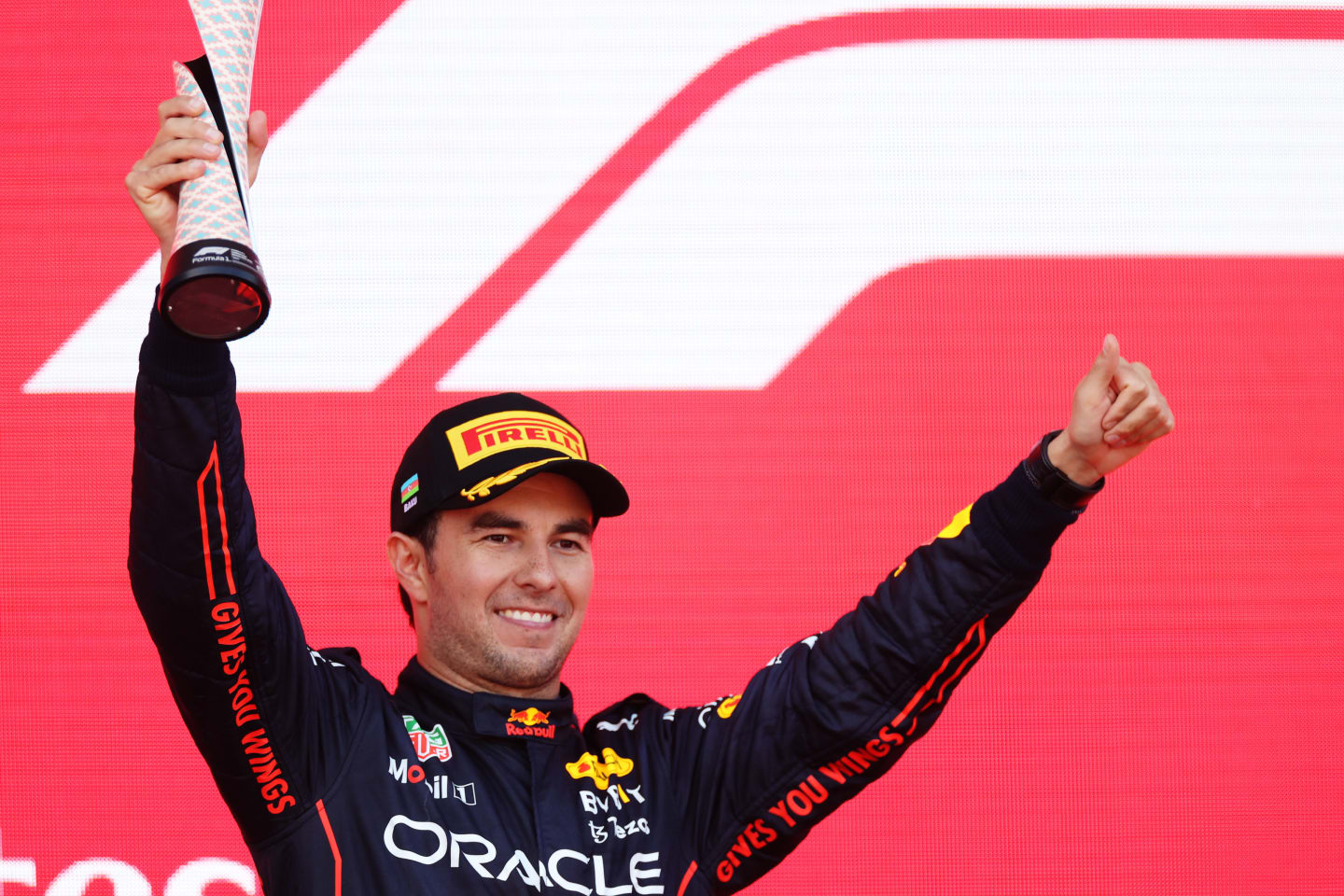 BAKU, AZERBAIJAN - JUNE 12: Second placed Sergio Perez of Mexico and Oracle Red Bull Racing celebrates on the podium during the F1 Grand Prix of Azerbaijan at Baku City Circuit on June 12, 2022 in Baku, Azerbaijan. (Photo by Peter Fox/Getty Images)