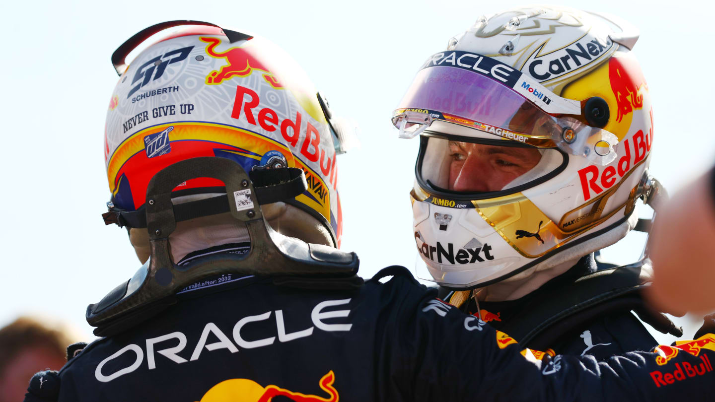 BAKU, AZERBAIJAN - JUNE 12: Race winner Max Verstappen of the Netherlands and Oracle Red Bull Racing and Second placed Sergio Perez of Mexico and Oracle Red Bull Racing celebrate in parc ferme during the F1 Grand Prix of Azerbaijan at Baku City Circuit on June 12, 2022 in Baku, Azerbaijan. (Photo by Dan Istitene - Formula 1/Formula 1 via Getty Images)