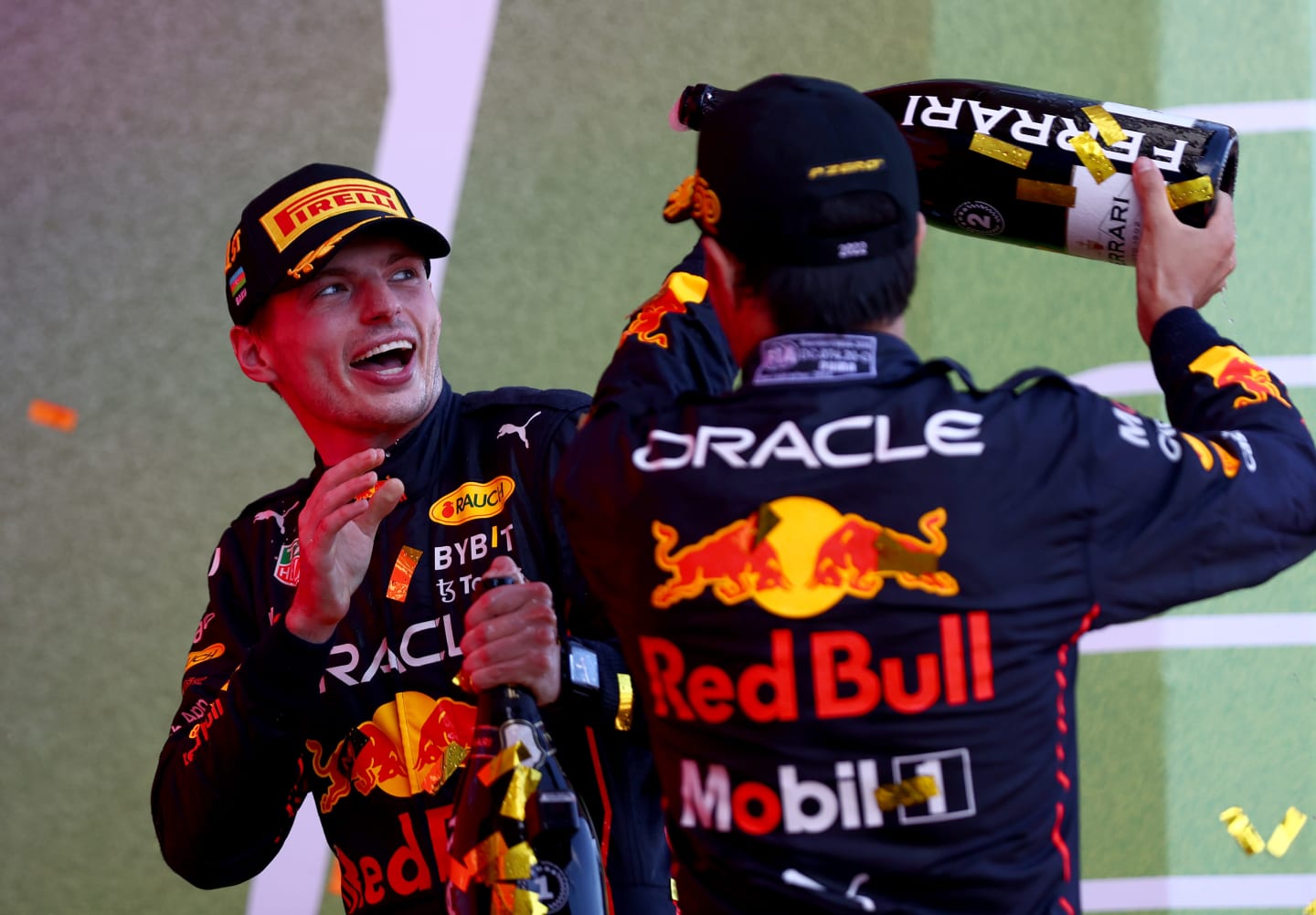 BAKU, AZERBAIJAN - JUNE 12: Race winner Max Verstappen of the Netherlands and Oracle Red Bull Racing and Second placed Sergio Perez of Mexico and Oracle Red Bull Racing celebrate on the podium during the F1 Grand Prix of Azerbaijan at Baku City Circuit on June 12, 2022 in Baku, Azerbaijan. (Photo by Dan Istitene - Formula 1/Formula 1 via Getty Images)
