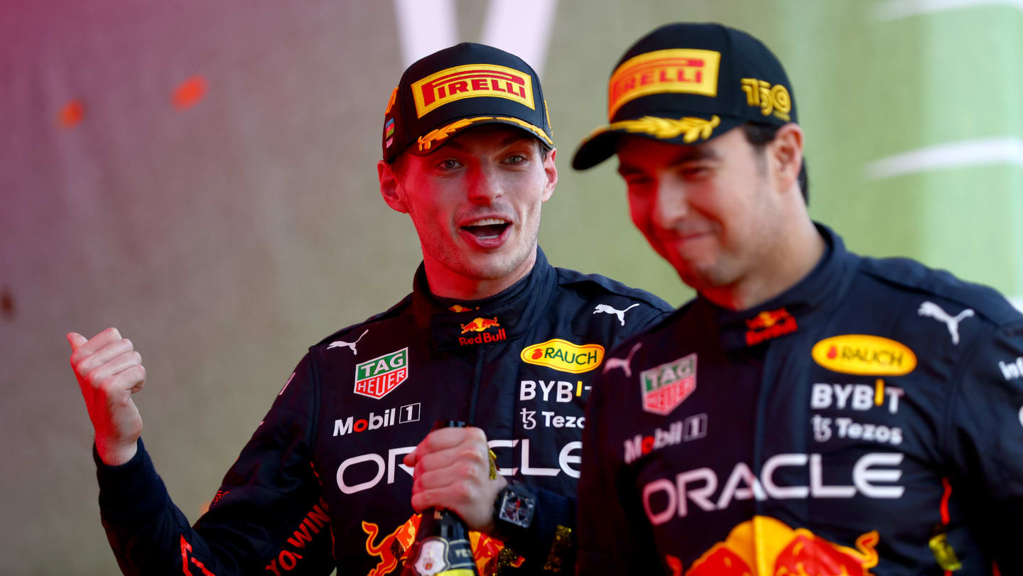 BAKU, AZERBAIJAN - JUNE 12: Race winner Max Verstappen of the Netherlands and Oracle Red Bull Racing and Second placed Sergio Perez of Mexico and Oracle Red Bull Racing celebrate on the podium during the F1 Grand Prix of Azerbaijan at Baku City Circuit on June 12, 2022 in Baku, Azerbaijan. (Photo by Dan Istitene - Formula 1/Formula 1 via Getty Images)