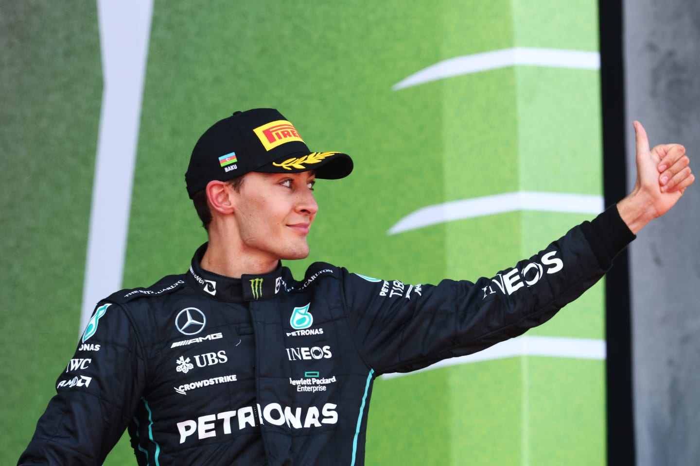 BAKU, AZERBAIJAN - JUNE 12: Third placed George Russell of Great Britain and Mercedes celebrates on the podium during the F1 Grand Prix of Azerbaijan at Baku City Circuit on June 12, 2022 in Baku, Azerbaijan. (Photo by Clive Rose/Getty Images)
