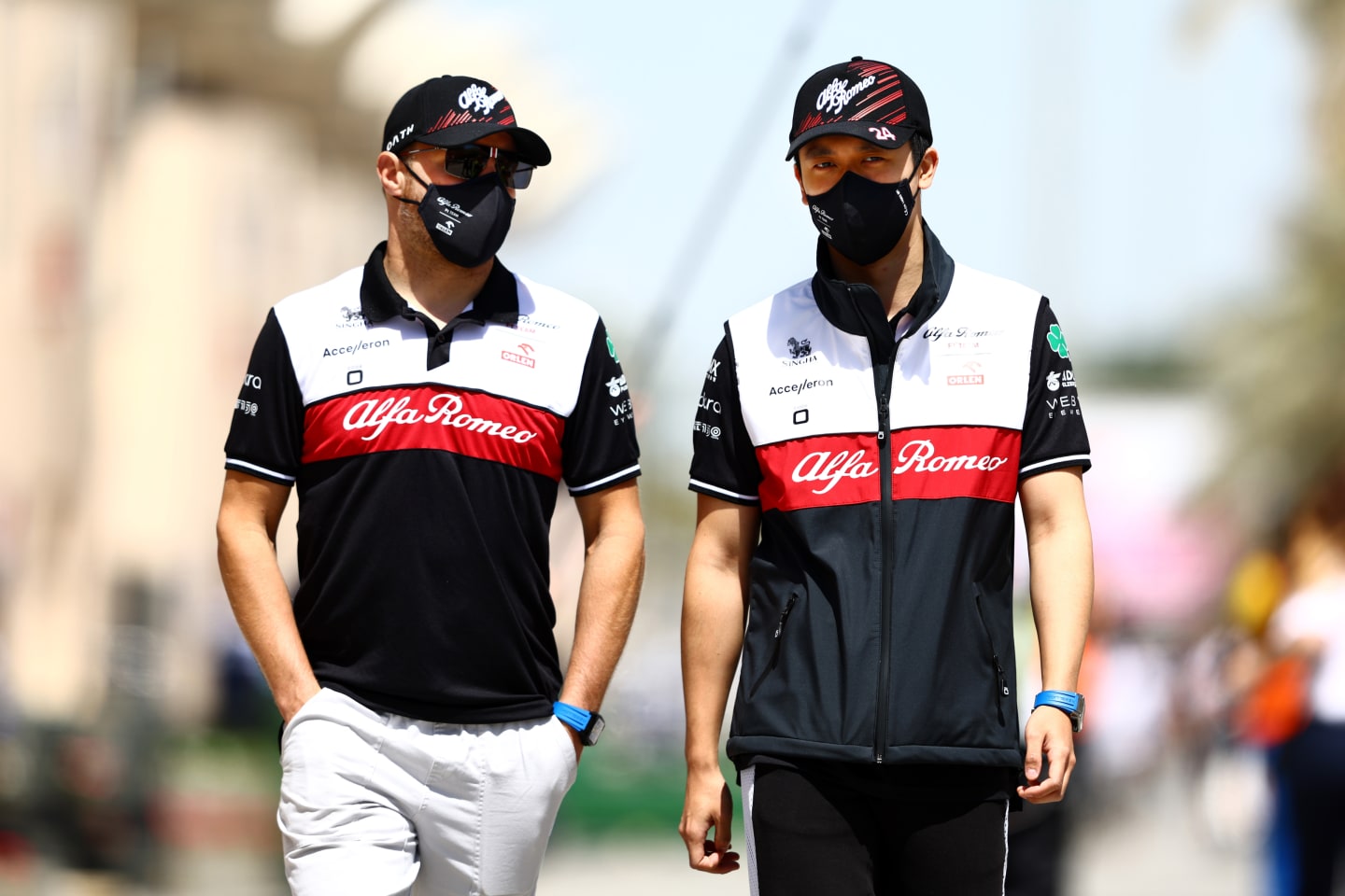 BAHRAIN, BAHRAIN - MARCH 18: Zhou Guanyu of China and Alfa Romeo F1 and Valtteri Bottas of Finland