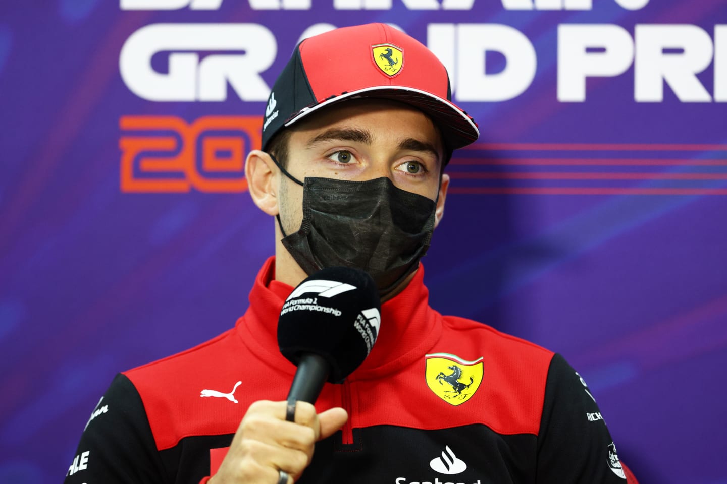 BAHRAIN, BAHRAIN - MARCH 18: Charles Leclerc of Monaco and Ferrari talks in the Drivers Press Conference before practice ahead of the F1 Grand Prix of Bahrain at Bahrain International Circuit on March 18, 2022 in Bahrain, Bahrain. (Photo by Clive Rose/Getty Images)