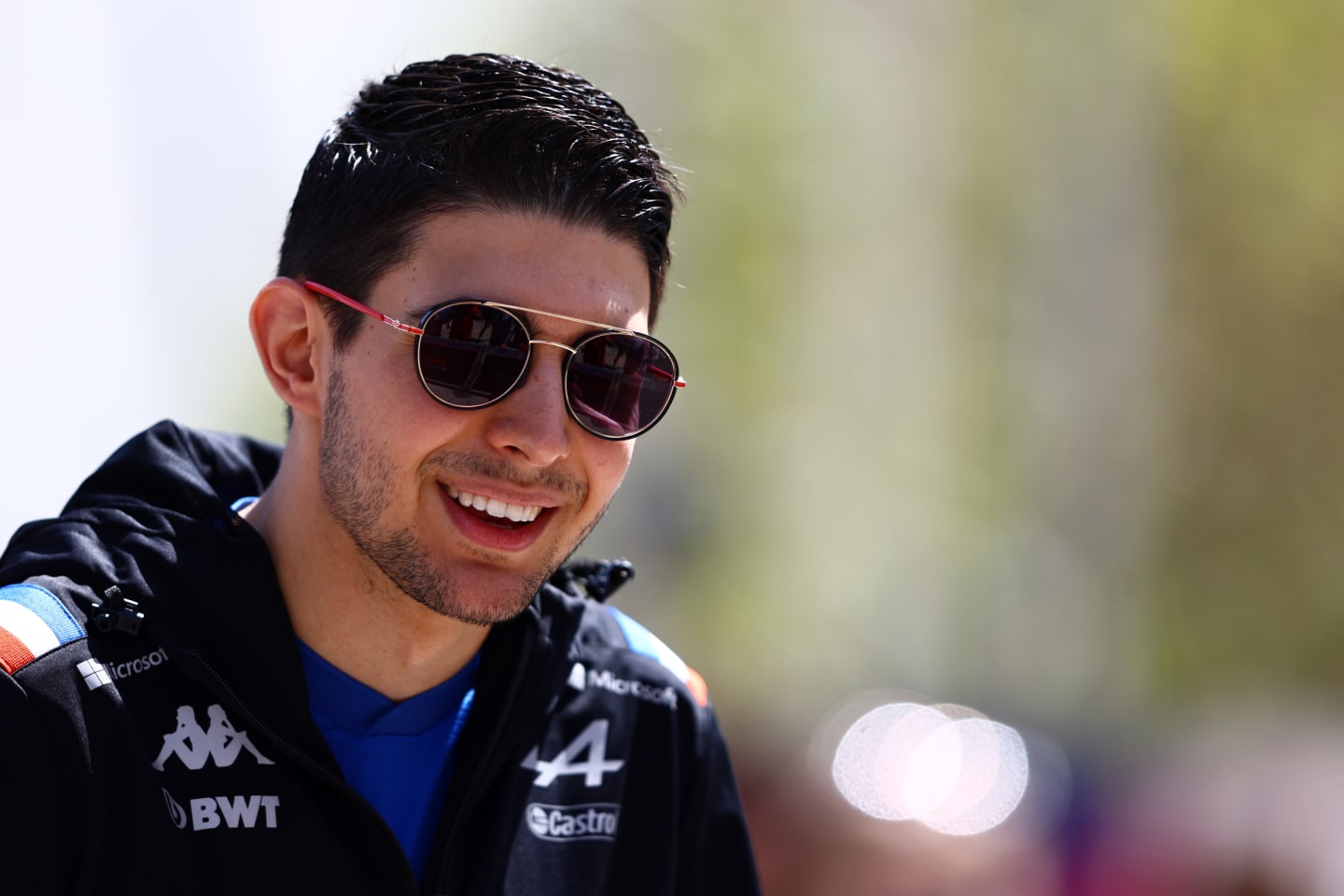 BAHRAIN, BAHRAIN - MARCH 18: Esteban Ocon of France and Alpine F1 looks on in the Paddock before practice ahead of the F1 Grand Prix of Bahrain at Bahrain International Circuit on March 18, 2022 in Bahrain, Bahrain. (Photo by Mark Thompson/Getty Images)
