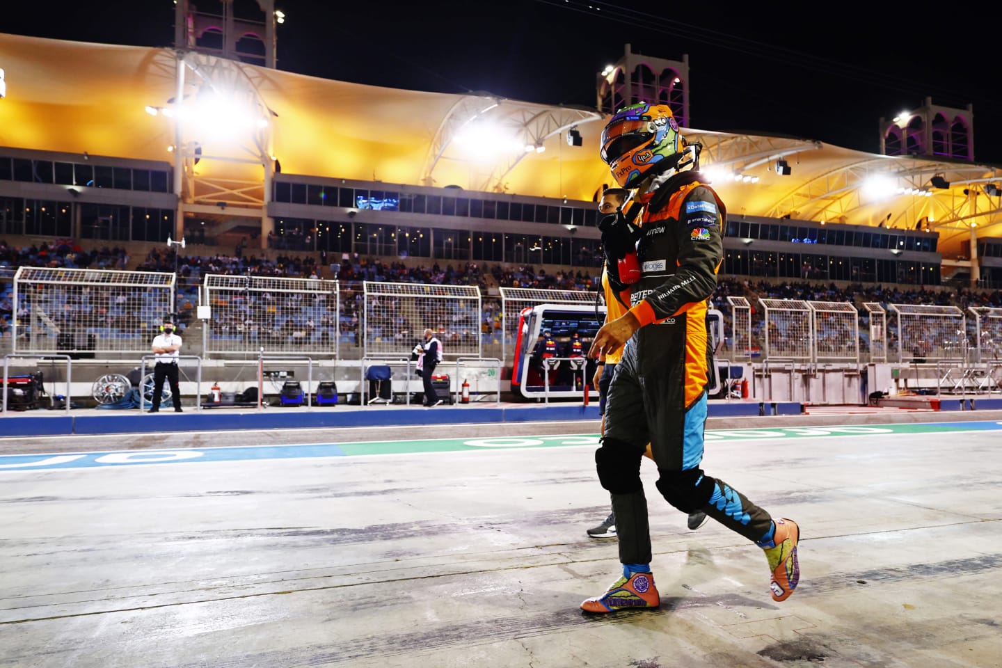 BAHRAIN, BAHRAIN - MARCH 19: Daniel Ricciardo of Australia and McLaren walks in the pitlane after