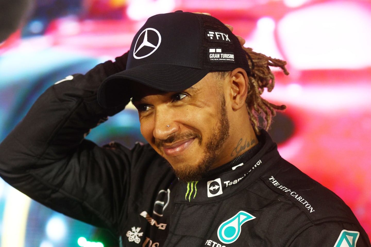 BAHRAIN, BAHRAIN - MARCH 20: Third placed Lewis Hamilton of Great Britain and Mercedes smiles in