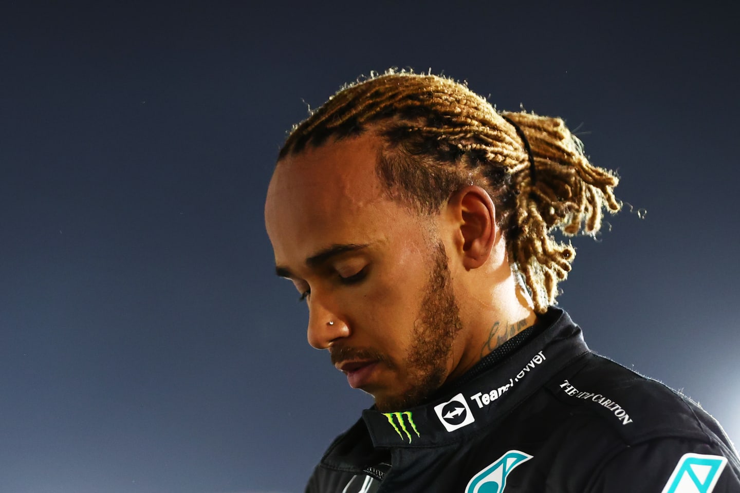 BAHRAIN, BAHRAIN - MARCH 20: Third placed Lewis Hamilton of Great Britain and Mercedes looks on in