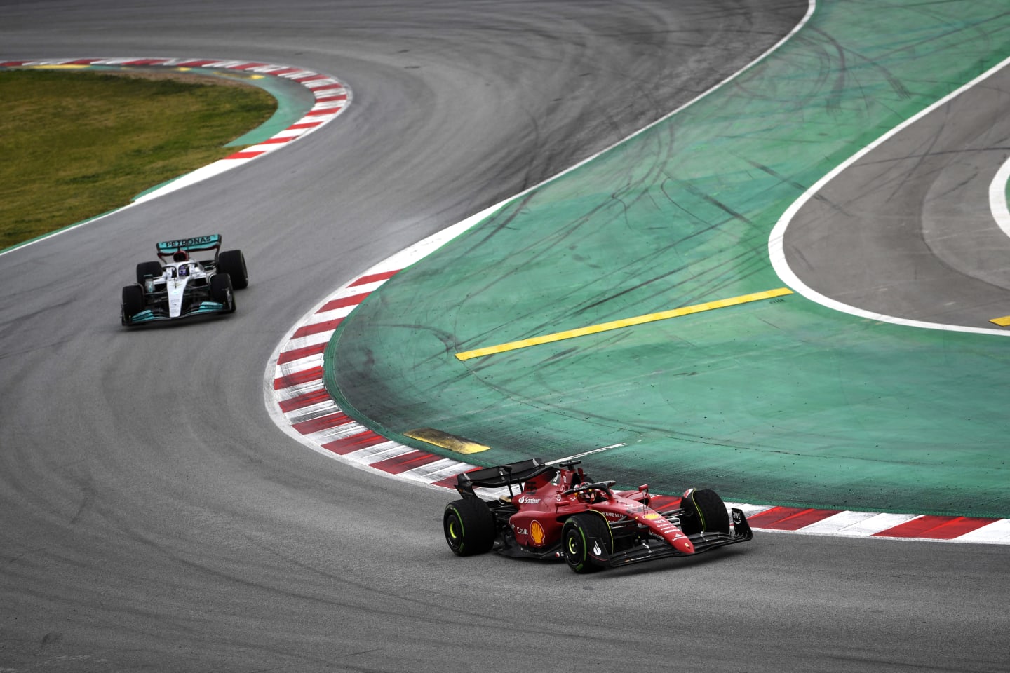 BARCELONA, SPAIN - FEBRUARY 25: Carlos Sainz of Spain driving (55) the Ferrari F1-75 leads Lewis