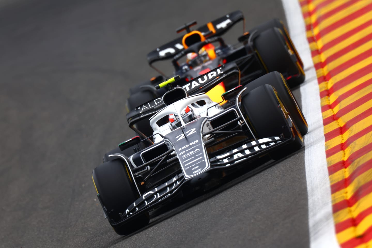 SPA, BELGIUM - AUGUST 26: Yuki Tsunoda of Japan driving the (22) Scuderia AlphaTauri AT03 leads Max