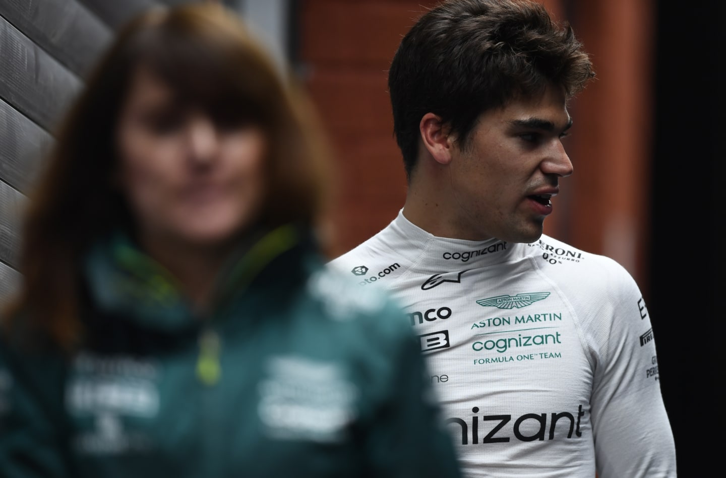 SPA, BELGIUM - AUGUST 27: 14th place qualifier Lance Stroll of Canada and Aston Martin F1 Team walks in the Paddock during qualifying ahead of the F1 Grand Prix of Belgium at Circuit de Spa-Francorchamps on August 27, 2022 in Spa, Belgium. (Photo by Rudy Carezzevoli/Getty Images)