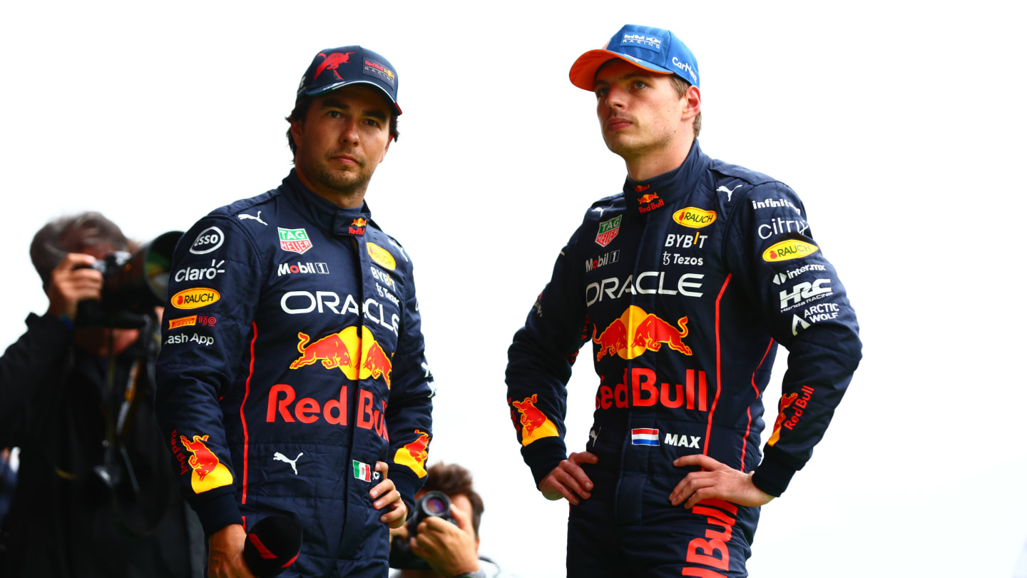 SPA, BELGIUM - AUGUST 27: Pole position qualifier Max Verstappen of the Netherlands and Oracle Red Bull Racing and Third placed qualifier Sergio Perez of Mexico and Oracle Red Bull Racing talk in parc ferme during qualifying ahead of the F1 Grand Prix of Belgium at Circuit de Spa-Francorchamps on August 27, 2022 in Spa, Belgium. (Photo by Dan Istitene - Formula 1/Formula 1 via Getty Images)