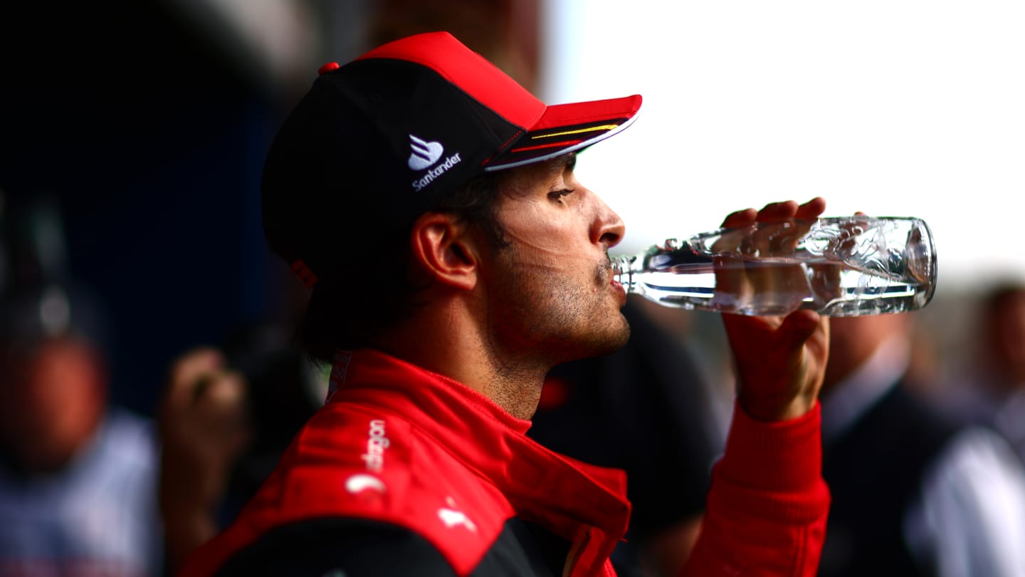 SPA, BELGIUM - AUGUST 28: Third placed Carlos Sainz of Spain and Ferrari drinks water following the