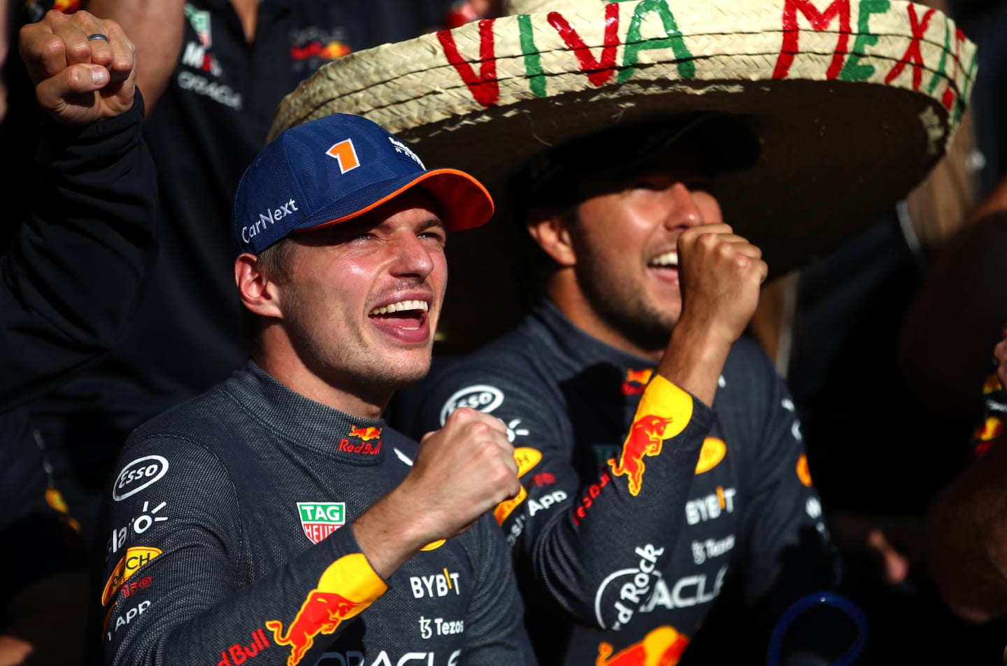 SPA, BELGIUM - AUGUST 28: Race winner Max Verstappen of the Netherlands and Oracle Red Bull Racing and Second placed Sergio Perez of Mexico and Oracle Red Bull Racing celebrate with their team after the F1 Grand Prix of Belgium at Circuit de Spa-Francorchamps on August 28, 2022 in Spa, Belgium. (Photo by Joe Portlock - Formula 1/Formula 1 via Getty Images)