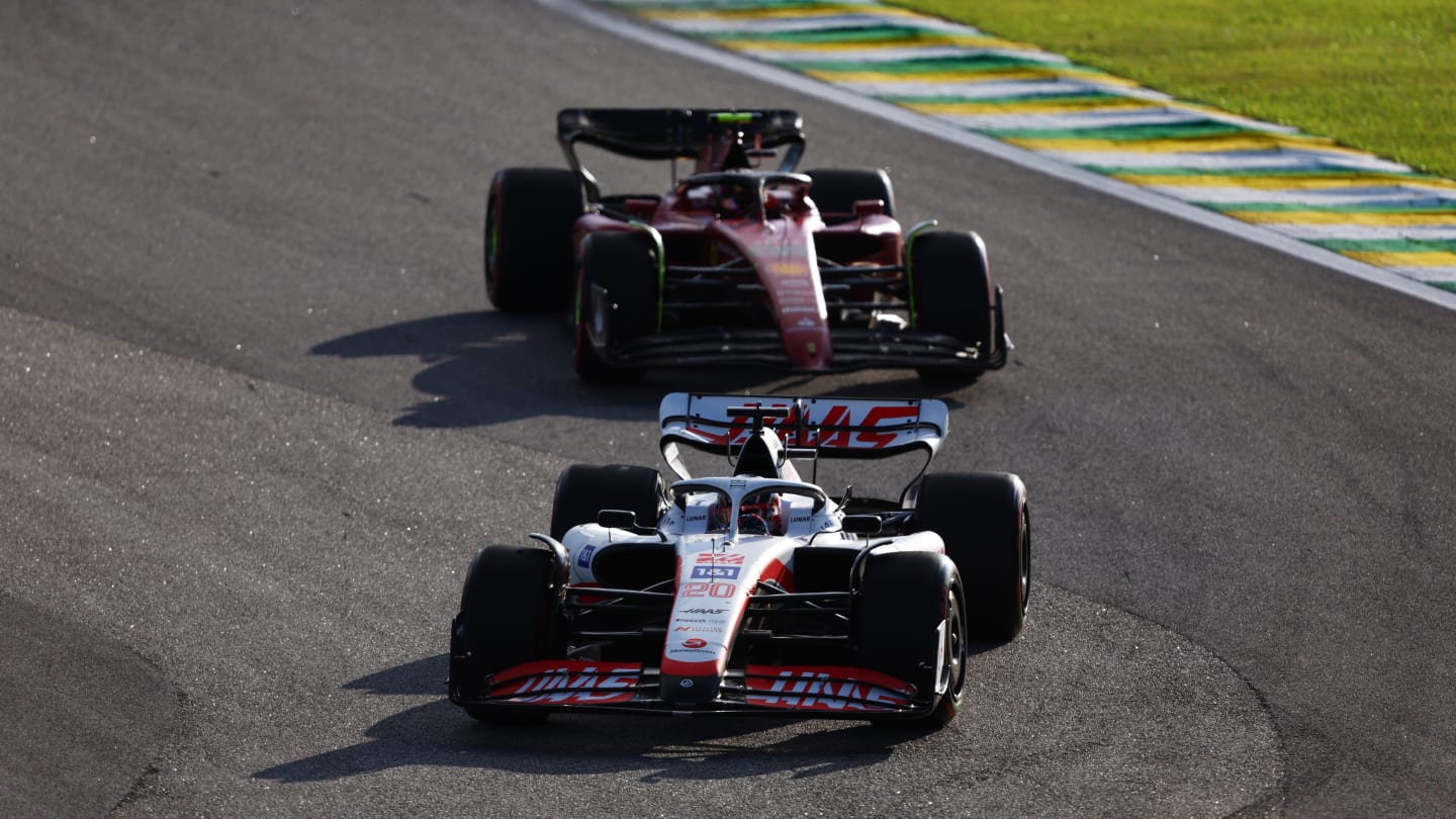 SAO PAULO, BRAZIL - NOVEMBER 12: Kevin Magnussen of Denmark driving the (20) Haas F1 VF-22 Ferrari leads Carlos Sainz of Spain driving (55) the Ferrari F1-75 during the Sprint ahead of the F1 Grand Prix of Brazil at Autodromo Jose Carlos Pace on November 12, 2022 in Sao Paulo, Brazil. (Photo by Bryn Lennon - Formula 1/Formula 1 via Getty Images)