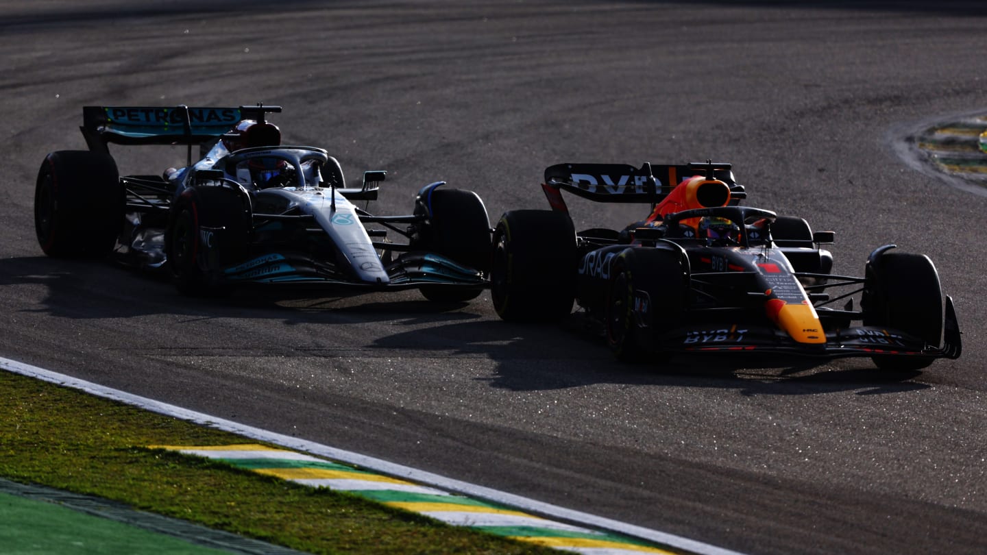 SAO PAULO, BRAZIL - NOVEMBER 12: Max Verstappen of the Netherlands driving the (1) Oracle Red Bull Racing RB18 leads George Russell of Great Britain driving the (63) Mercedes AMG Petronas F1 Team W13 during the Sprint ahead of the F1 Grand Prix of Brazil at Autodromo Jose Carlos Pace on November 12, 2022 in Sao Paulo, Brazil. (Photo by Bryn Lennon - Formula 1/Formula 1 via Getty Images)