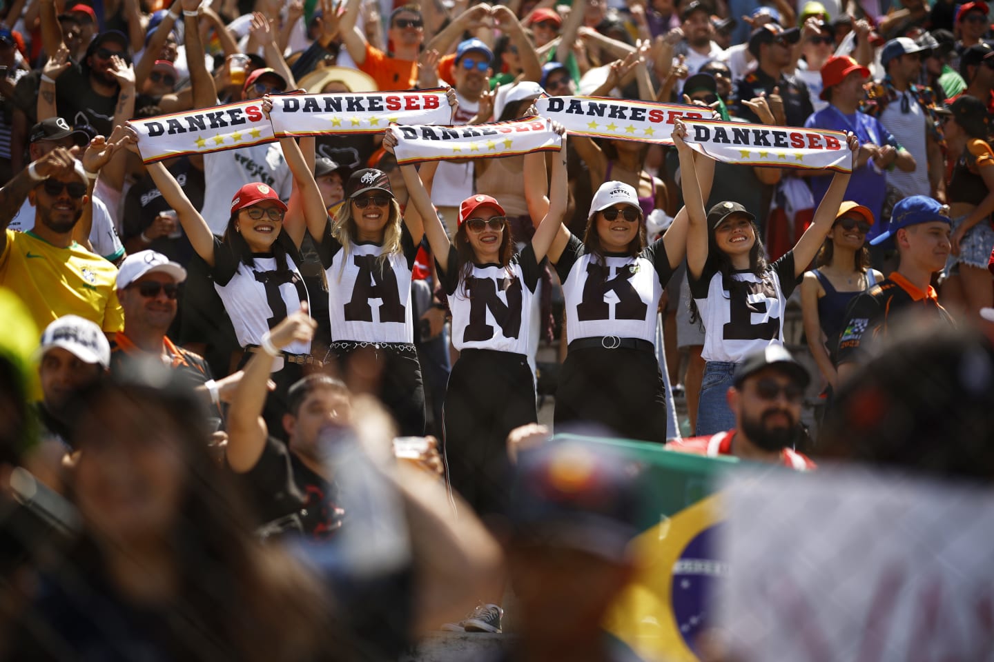 SAO PAULO, BRAZIL - NOVEMBER 13: Sebastian Vettel of Germany and Aston Martin F1 Team fans show