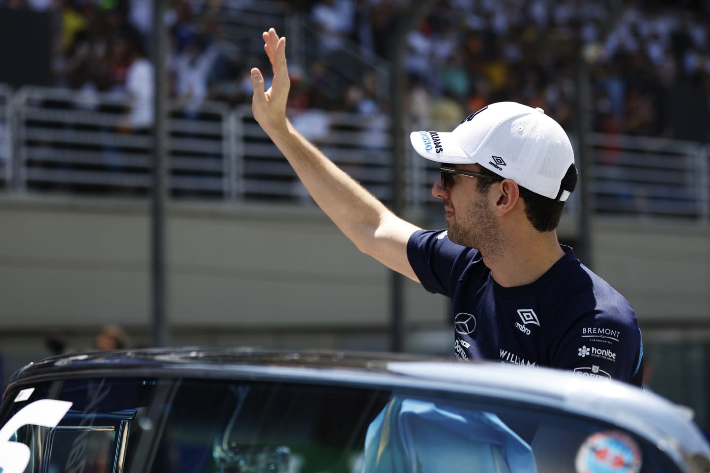 SAO PAULO, BRAZIL - NOVEMBER 13: Nicholas Latifi of Canada and Williams waves to the crowd on the drivers parade prior to the F1 Grand Prix of Brazil at Autodromo Jose Carlos Pace on November 13, 2022 in Sao Paulo, Brazil. (Photo by Jared C. Tilton/Getty Images)