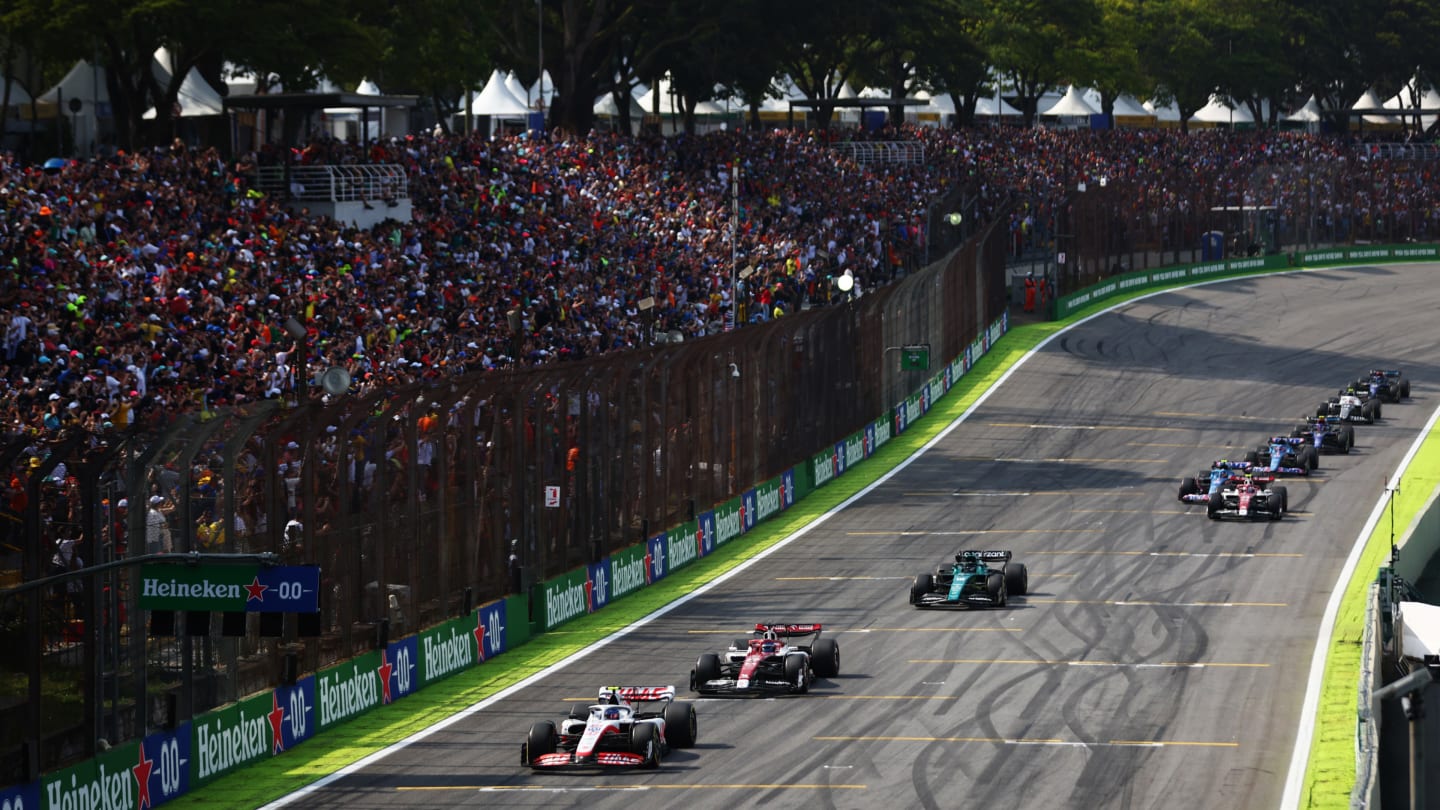 SAO PAULO, BRAZIL - NOVEMBER 13: Mick Schumacher of Germany driving the (47) Haas F1 VF-22 Ferrari leads a line of cars during the F1 Grand Prix of Brazil at Autodromo Jose Carlos Pace on November 13, 2022 in Sao Paulo, Brazil. (Photo by Dan Istitene - Formula 1/Formula 1 via Getty Images)