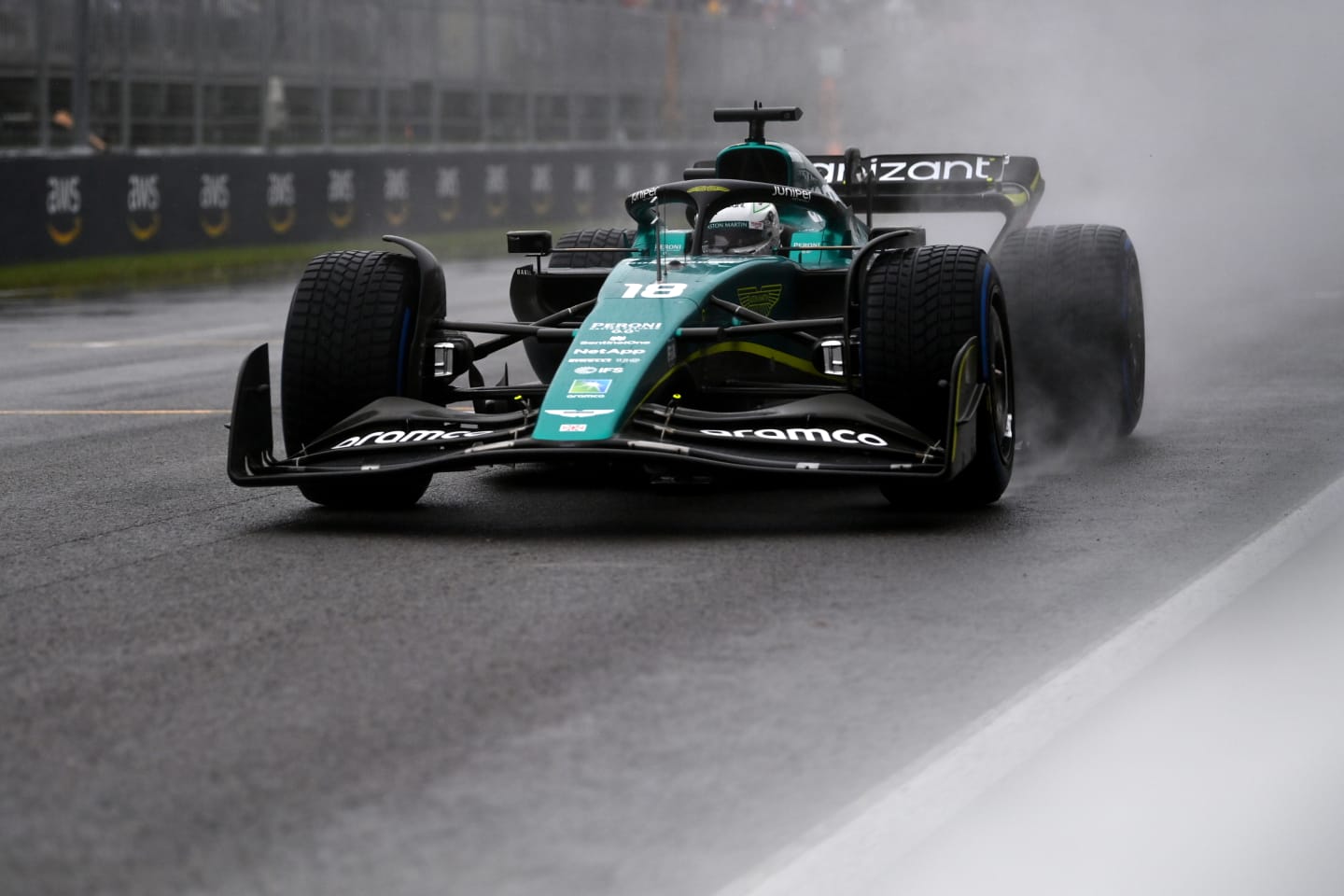 MONTREAL, QUEBEC - JUNE 18: Lance Stroll of Canada driving the (18) Aston Martin AMR22 Mercedes in the wet during qualifying ahead of the F1 Grand Prix of Canada at Circuit Gilles Villeneuve on June 18, 2022 in Montreal, Quebec. (Photo by Dan Mullan/Getty Images)